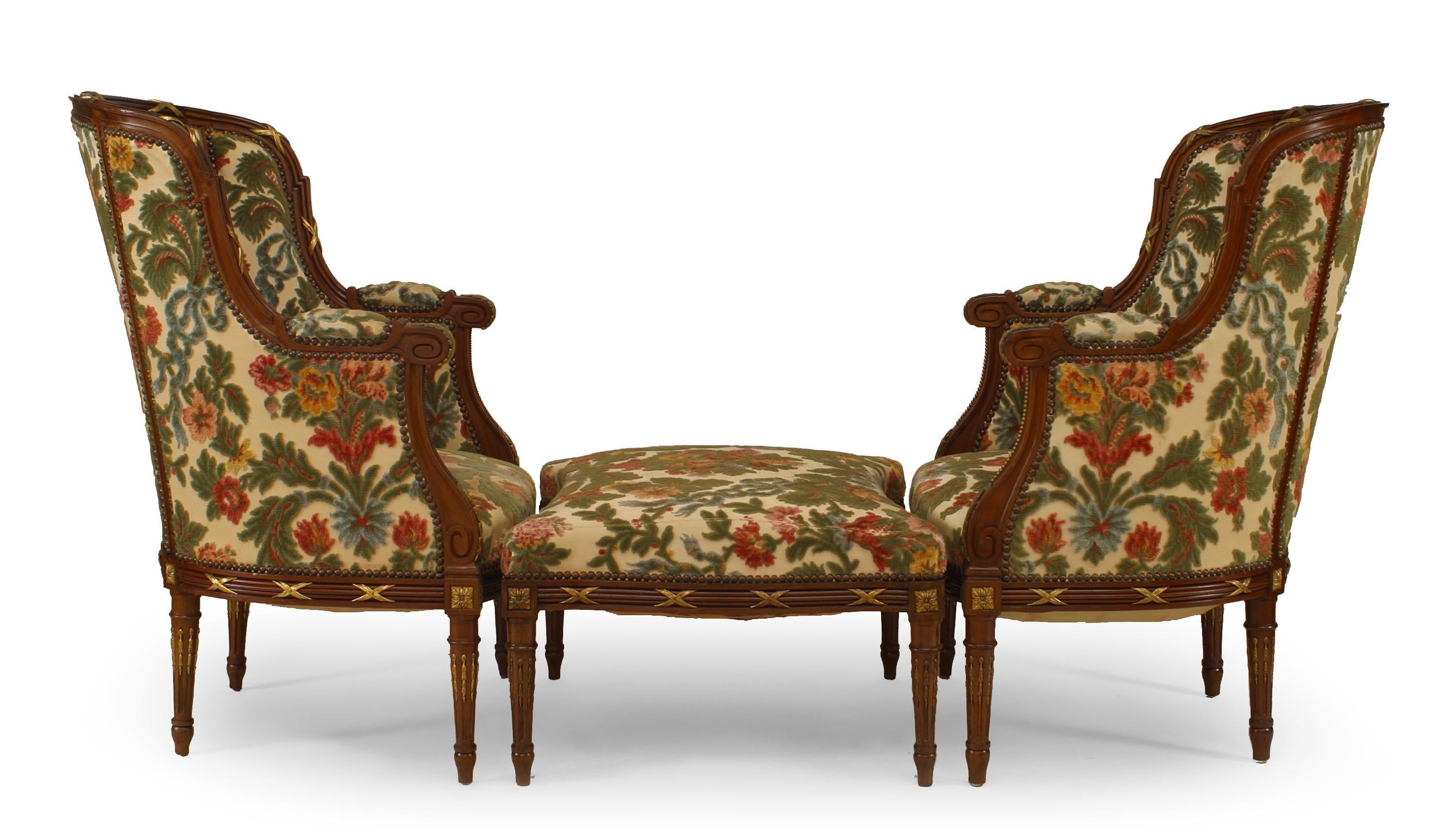 3-Piece Set of French Louis XVI-style (20th Century) bergeres with floral cut velvet tapestry upholstery with matching ottoman (PRICED AS SET).
 