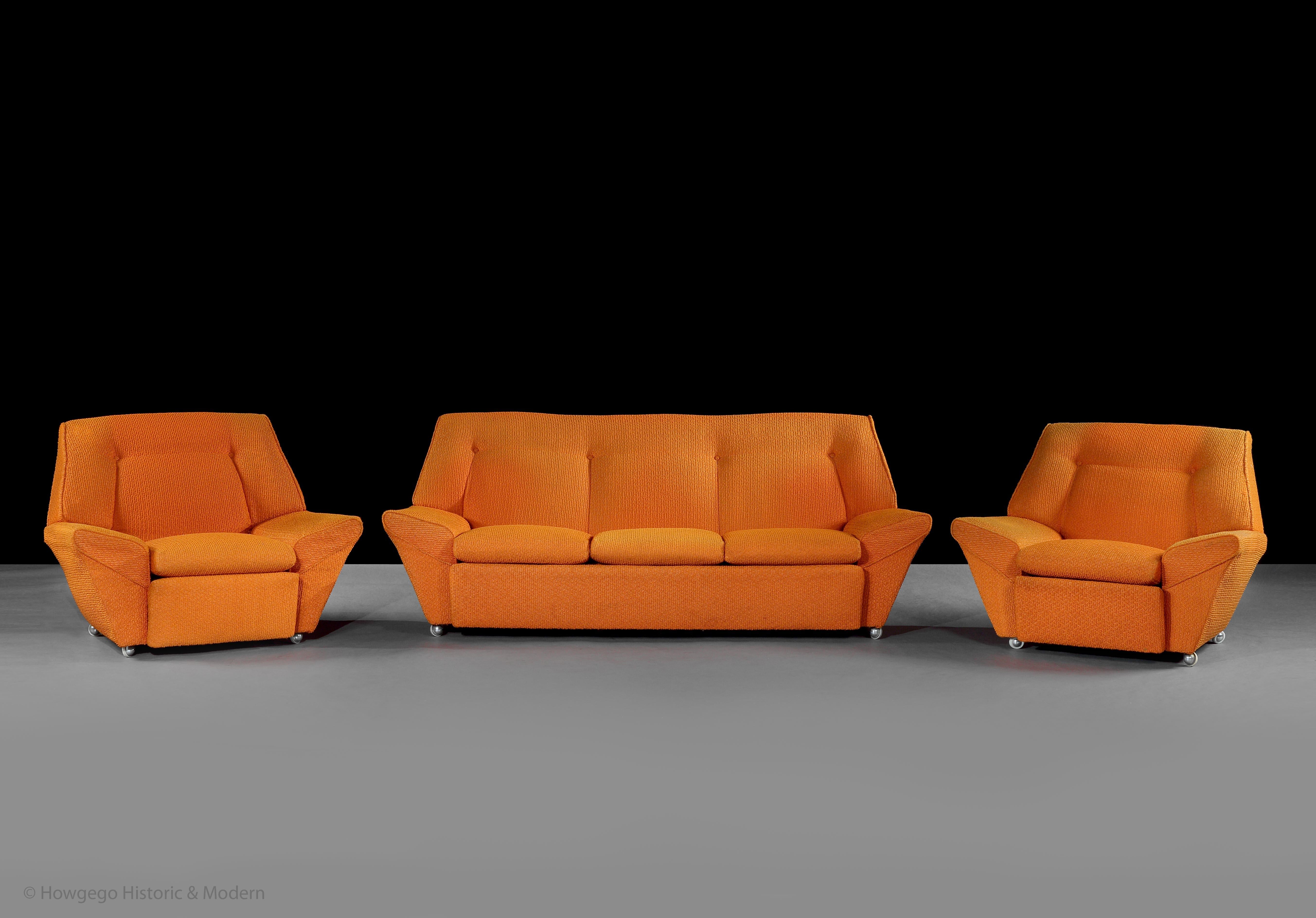Rare, vintage 1970's, 3-piece lounge suite comprising a 3 seater, settee or sofa and a pair of armchairs all with original, orange boucle upholstery in fabulous condition and original castors


Just purchased more information to follow or available