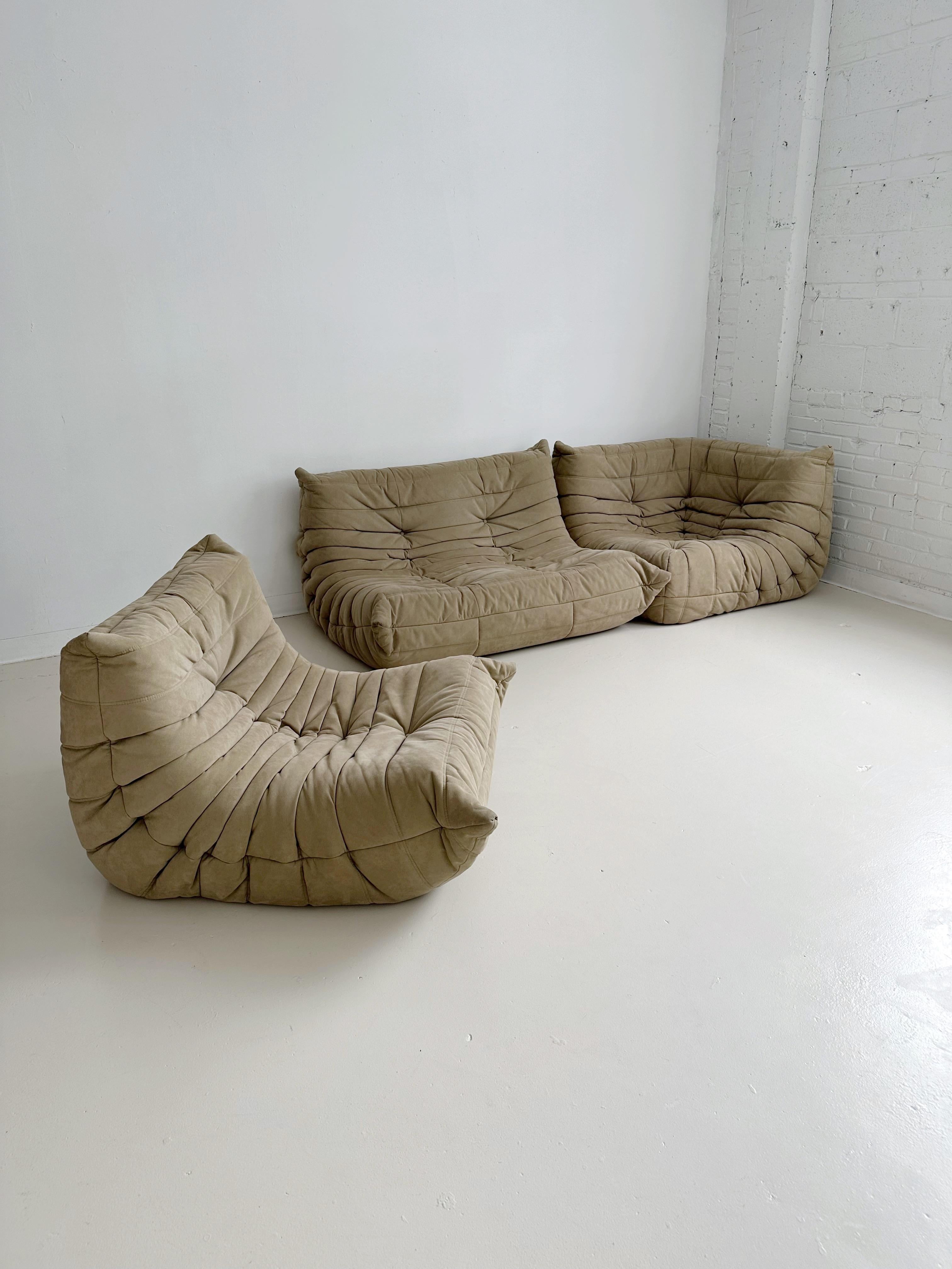 Sand Alcantara Togo sofa set by Michel Ducaroy for Ligne Roset

The set consists of one two seater, one corner and one single seat Togo.

Alcantara is the benchmark high-end microfibre brand that Ligne Roset uses, easy to clean and extremely
