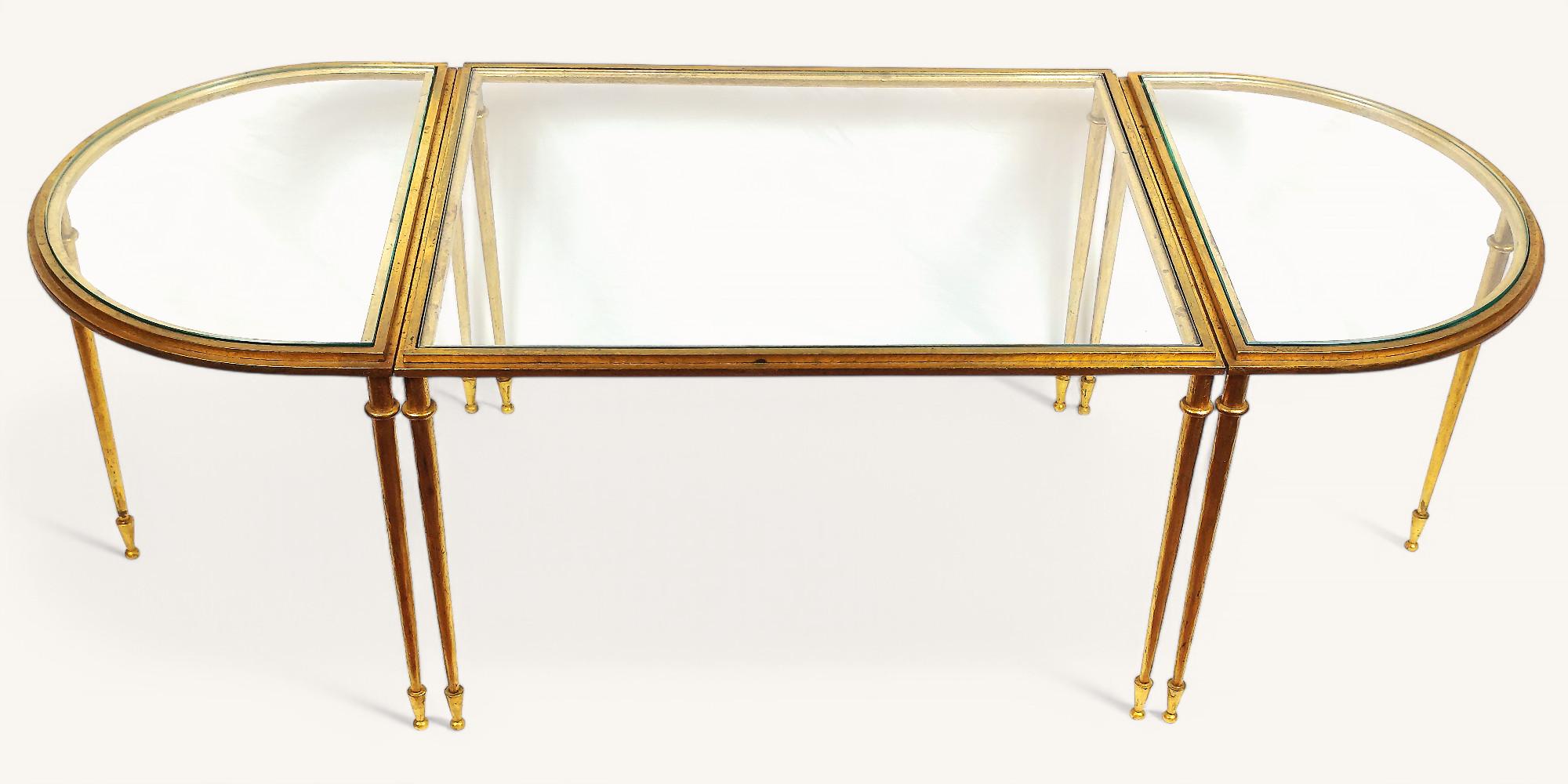 Very rare three-piece coffee table by Robert Thibier (1926-2001) with a rectangular central section and two semi-circular sections. Tapered legs.

The whole is made of gilt metal in excellent condition. 

The individual sections are signed with the