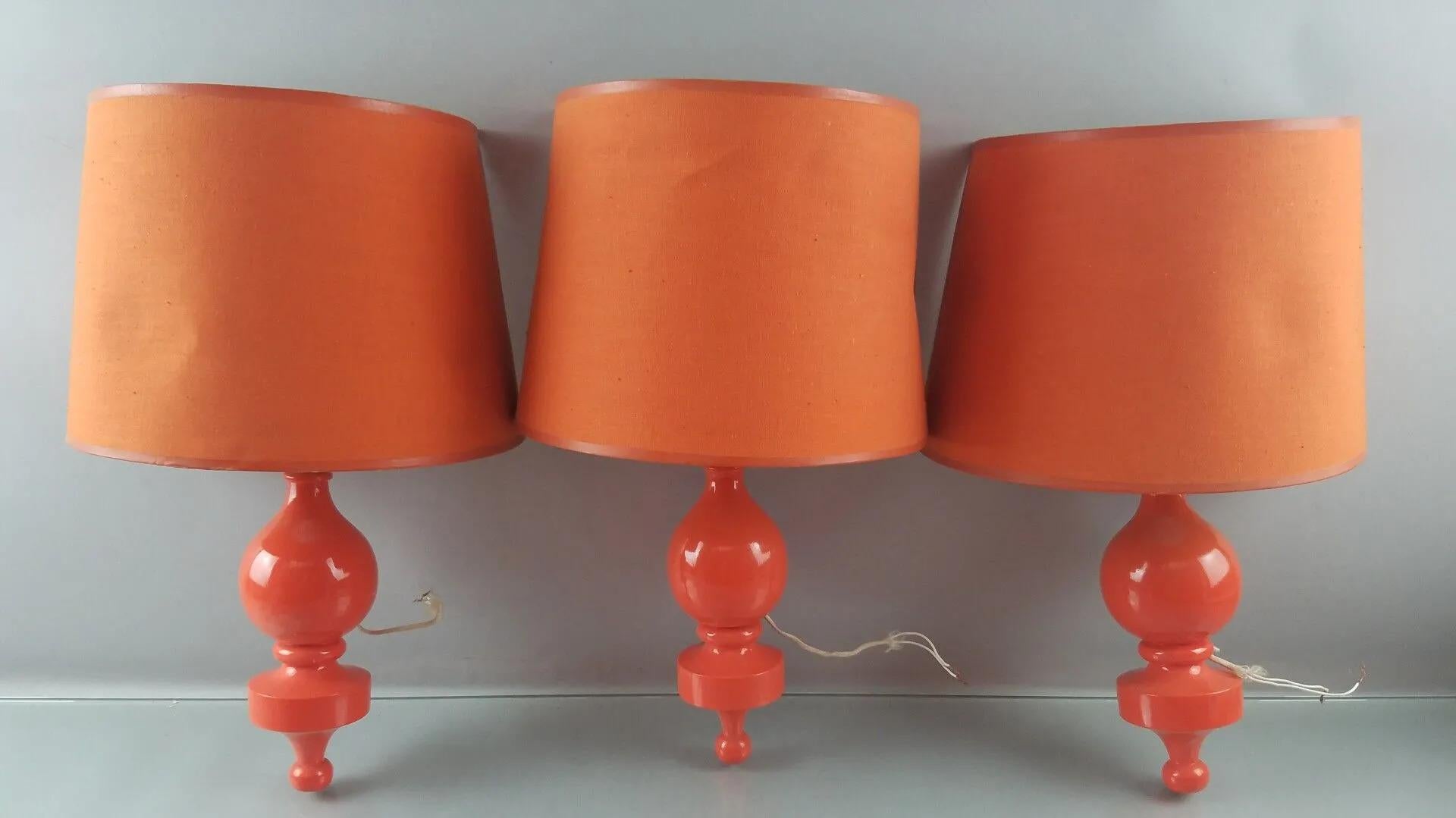 Philippe CAPELLE (XX-XXI ème) 
3 popdesign wall lights in lacquered wood circa 1970.
small strokes on the lampshades,
1 wall lamp is very slightly different.