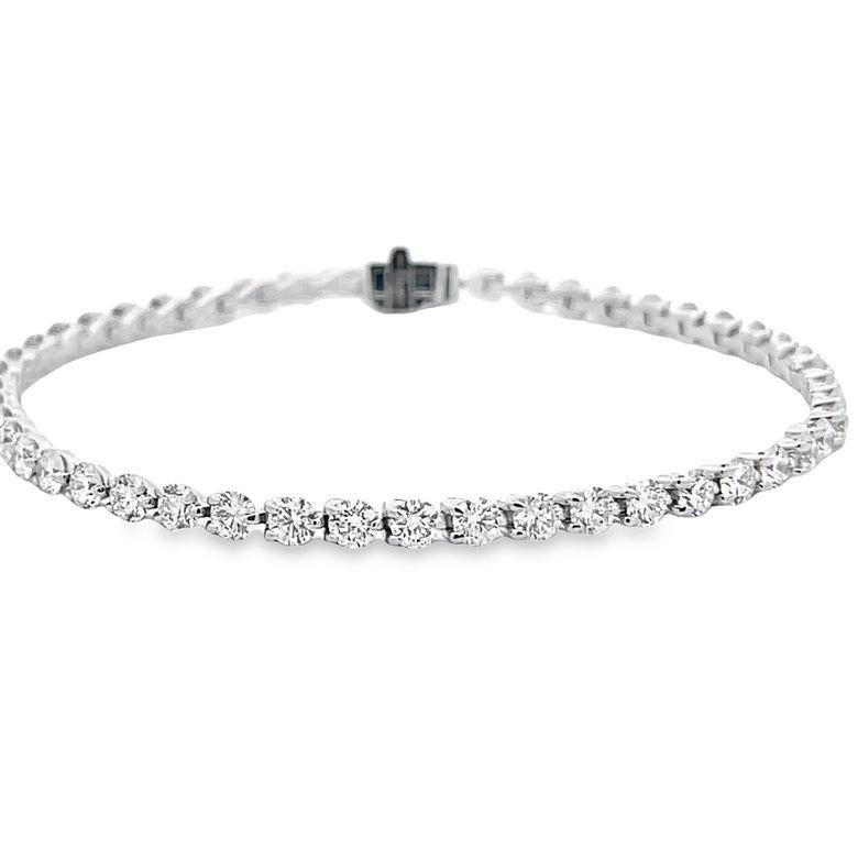 This exquisite tennis bracelet is a must-have for your jewelry collection. It is made from high-quality 14K white gold which has been polished to perfection, giving it a radiant and luxurious appearance. The bracelet features a stunning design that
