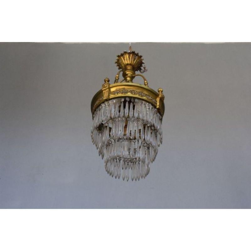 3-Row gilt bronze basket chandelier with pendants and crystal cut. Very good quality of carving and gilding of the bronzes. Size height 65 cm.

Additional information:
Material: Bronze, glass & crystal
Dimension: 65 H cm.