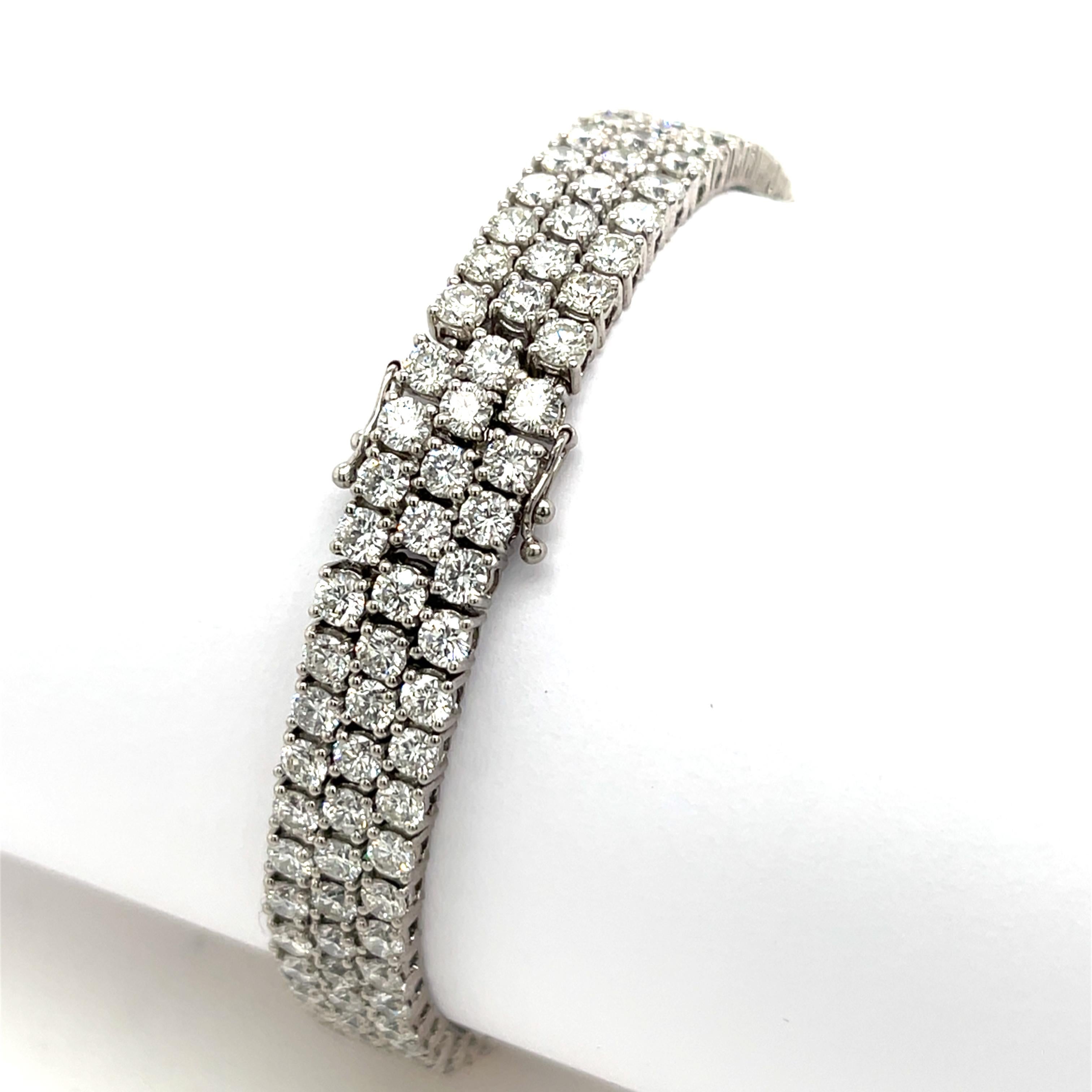 A stunning 3 row tennis bracelet set with 14.539ct of natural diamonds, crafted in 18ct white gold. The diamonds are expertly arranged in a continuous line, offering timeless elegance and exceptional brilliance. 
Perfect for special occasions or as