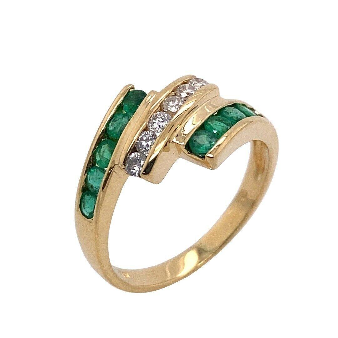 3-Row Emerald & Diamond Channel Set Ring, In 18ct Yellow Gold

This classic and elegant emerald and diamond channel set ring is set with 10 round brilliant cut diamonds & 6 round emeralds set in 18ct yellow gold. This stunning ring is a beautiful