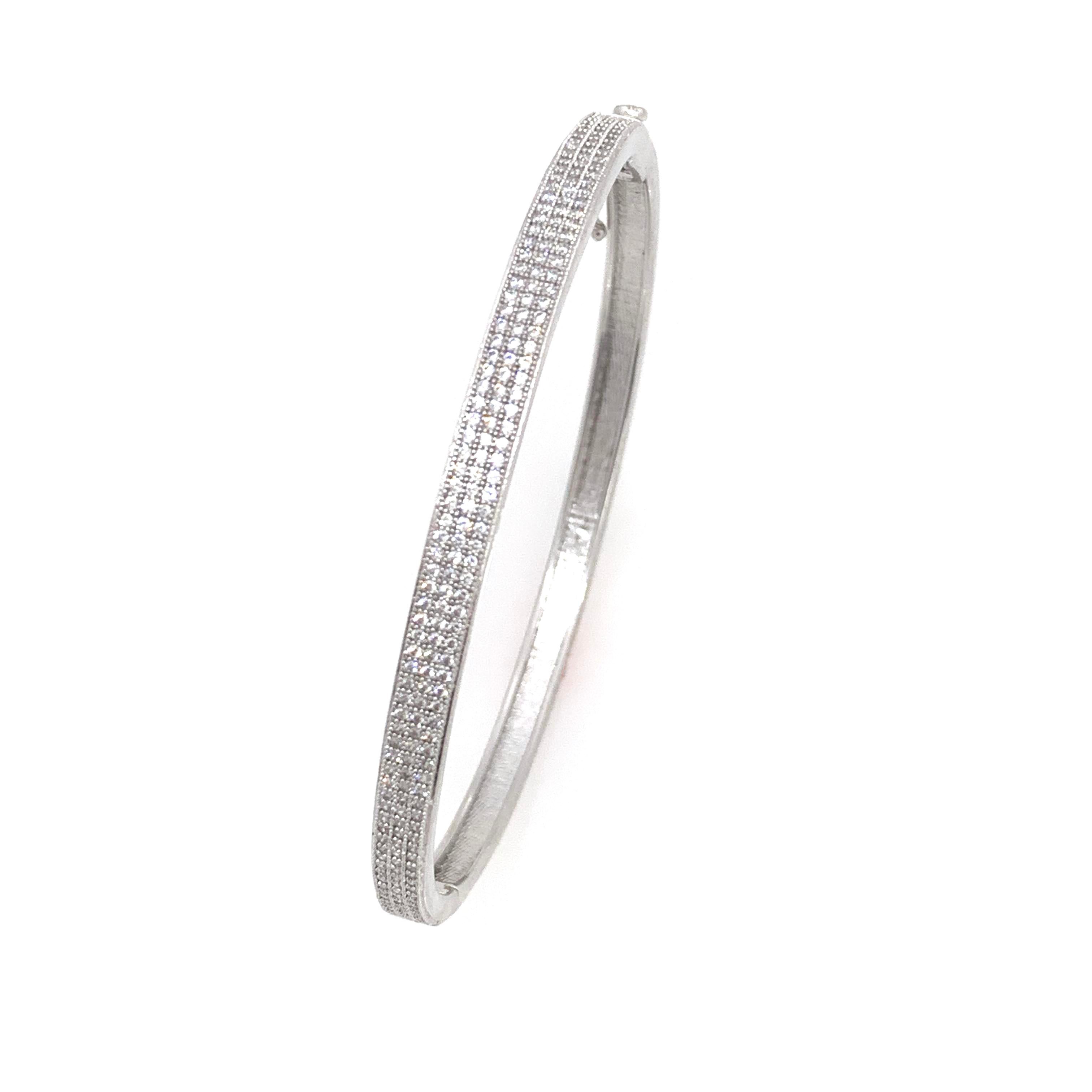 3-row Micropave Simulated Diamond Sterling Silver Bangle Bracelet.

This chic and modern bracelet features over 200 pcs of round simulated diamond, micro set on platinum rhodium plated sterling silver, push clasp closure and ‘8’ safety lock. The
