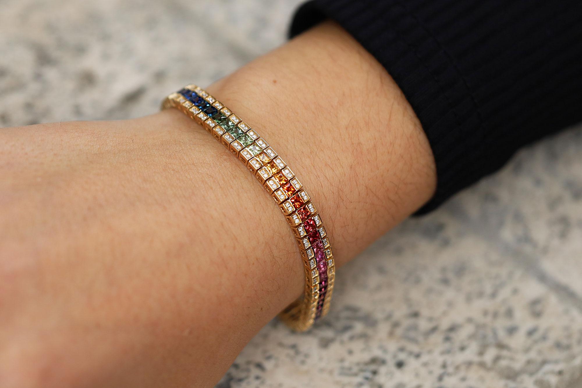 A modern playful twist on the classic line bracelet, 62 princess cut fancy, multi color sapphires with the vivid, bright and deeply saturated gradient colors of a rainbow grace this stunning tennis bracelet. A great stacking piece, but also a
