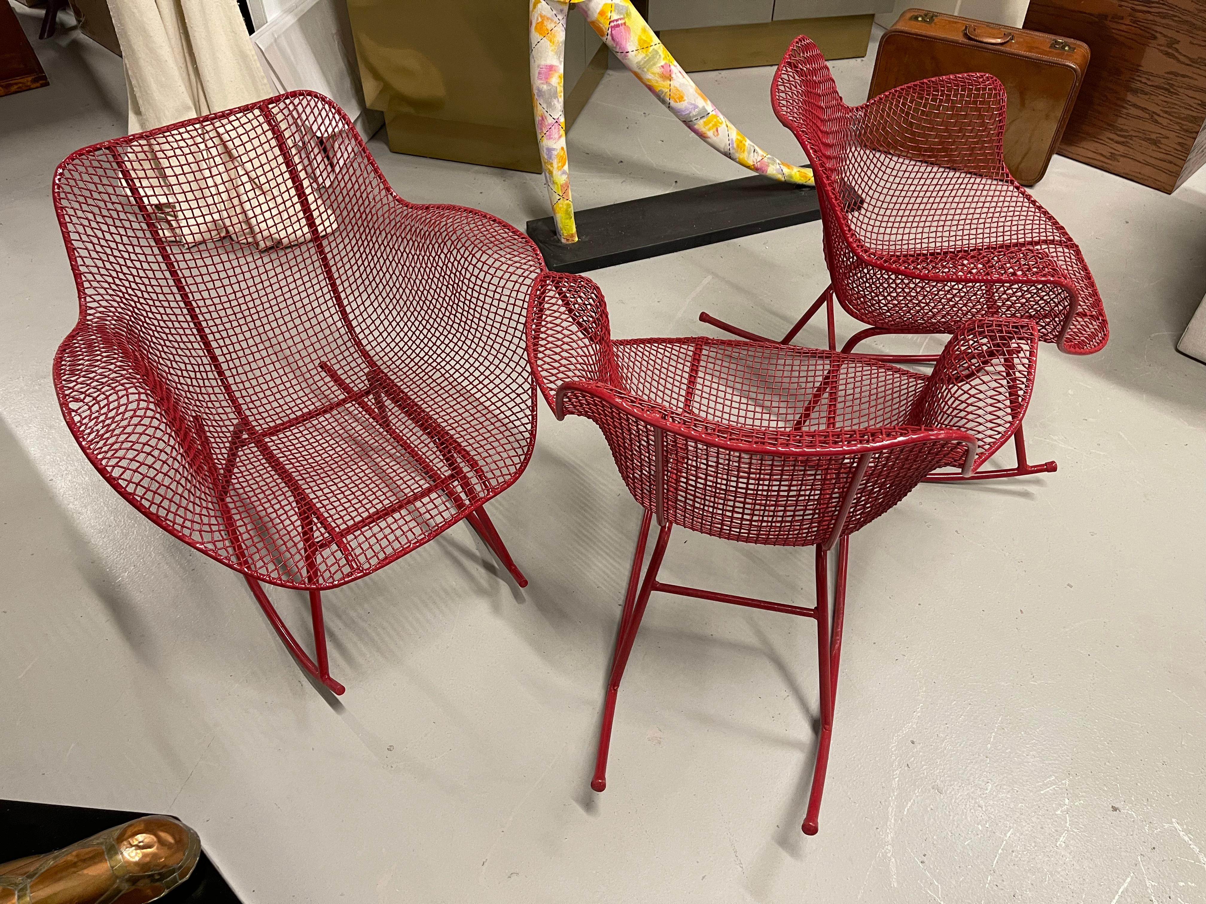 A set of three Russell Woodard Sculptura Rocking chairs or rockers. In good condition with no breaks. Some minor paint loss. No pad inserts.