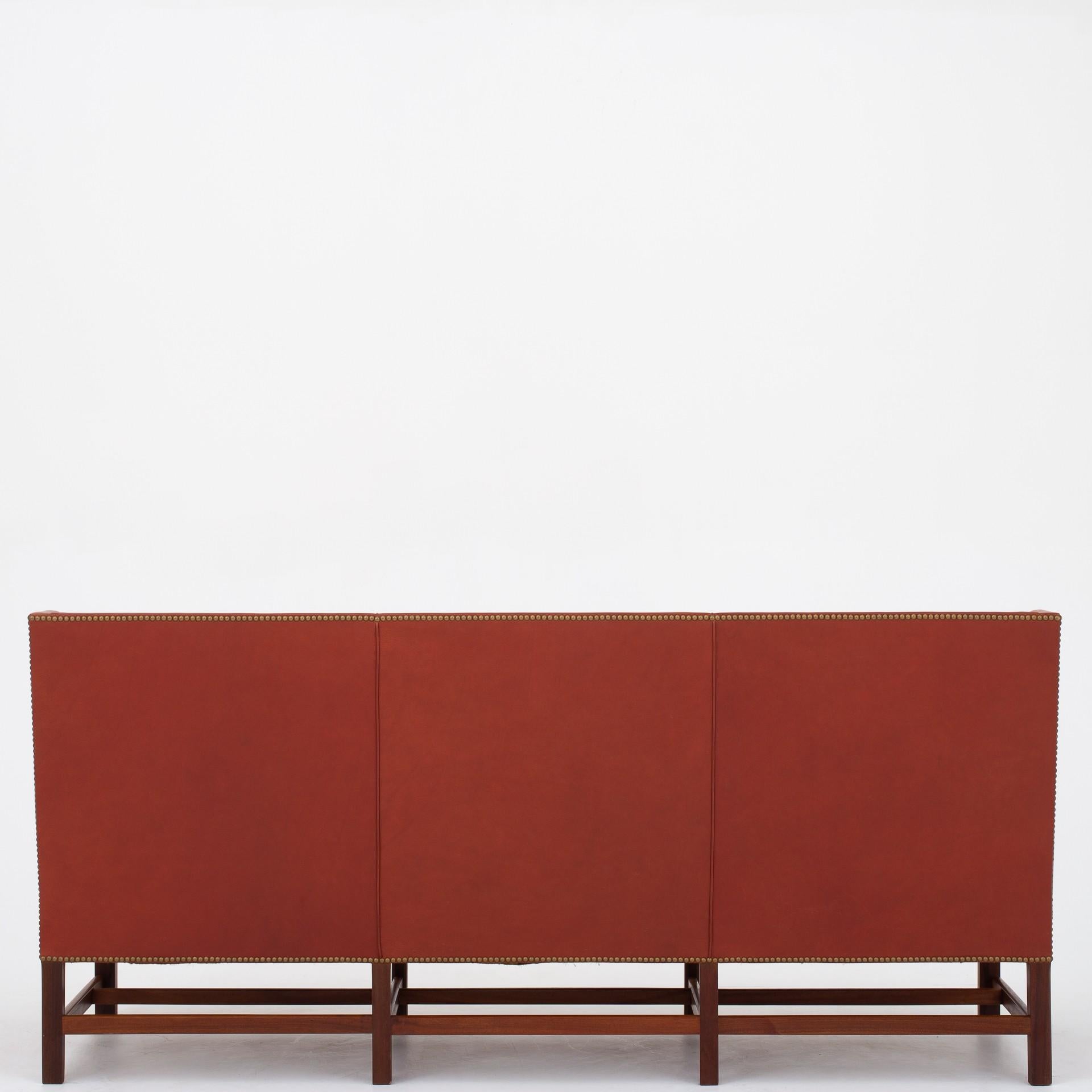 KK 5011 - Sofa in original red, stitched leather with frame in mahogany. Maker Rud. Rasmussen.