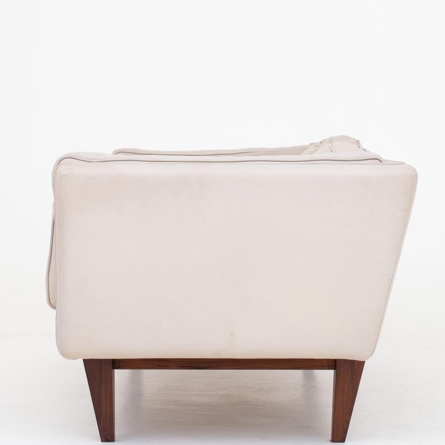 V11 - 2-seat sofa in light leather with rosewood legs. Maker Holger Christensen.