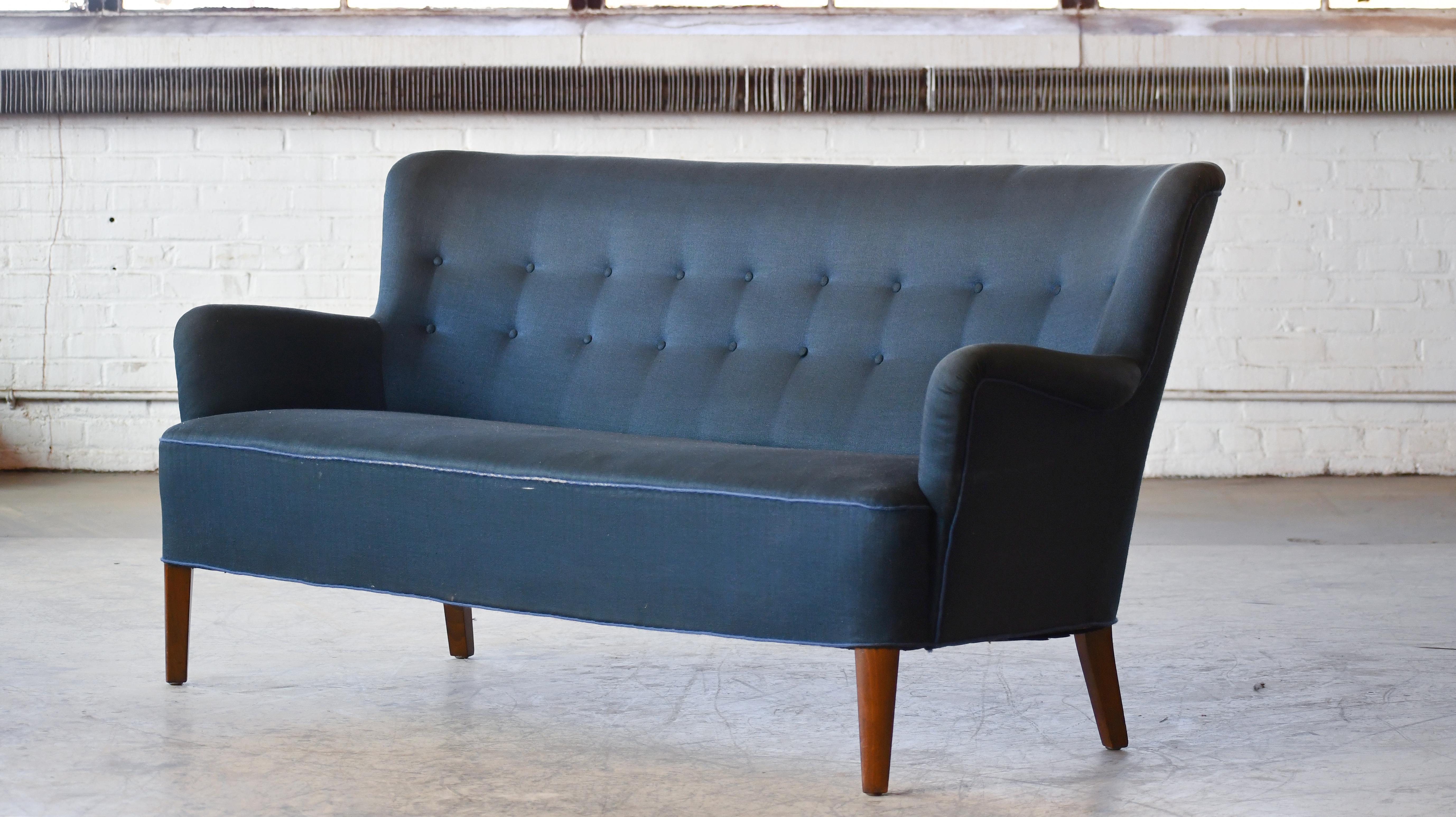 Orla Mølgaard-Nielsen's significant work has been mainly carried out together with his partner, Peter Hvidt, but the designer’s earlier models - like this sofa - are widely renowned for their understated elegance and quality. This rare sofa was