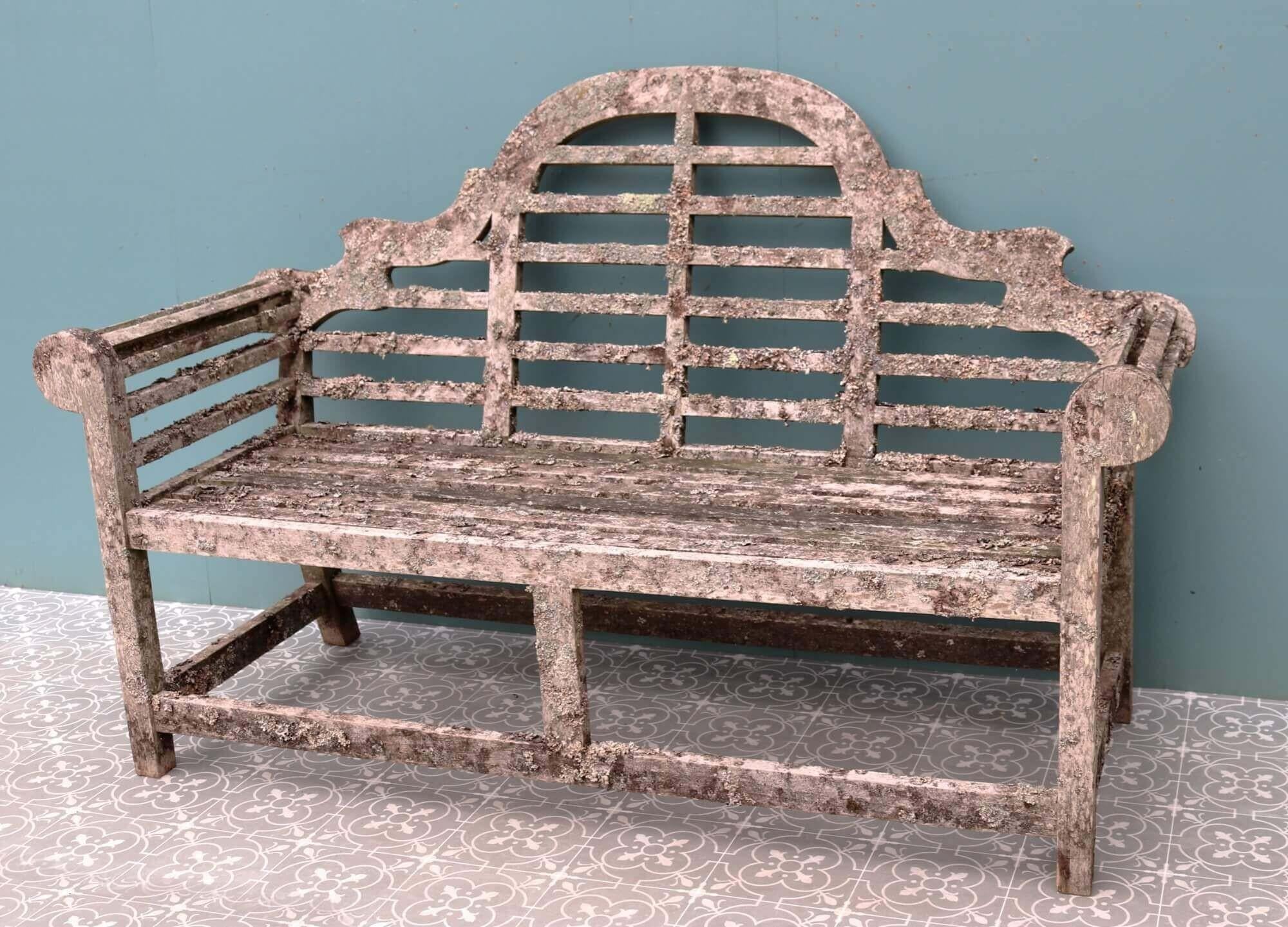 This elegant 3 seater reclaimed bench is a beautiful addition to a country garden or courtyard. Handmade in solid teak, it has aged beautifully over time, instilling the wood with an enchanting silver hue while lichens and weathering give it an