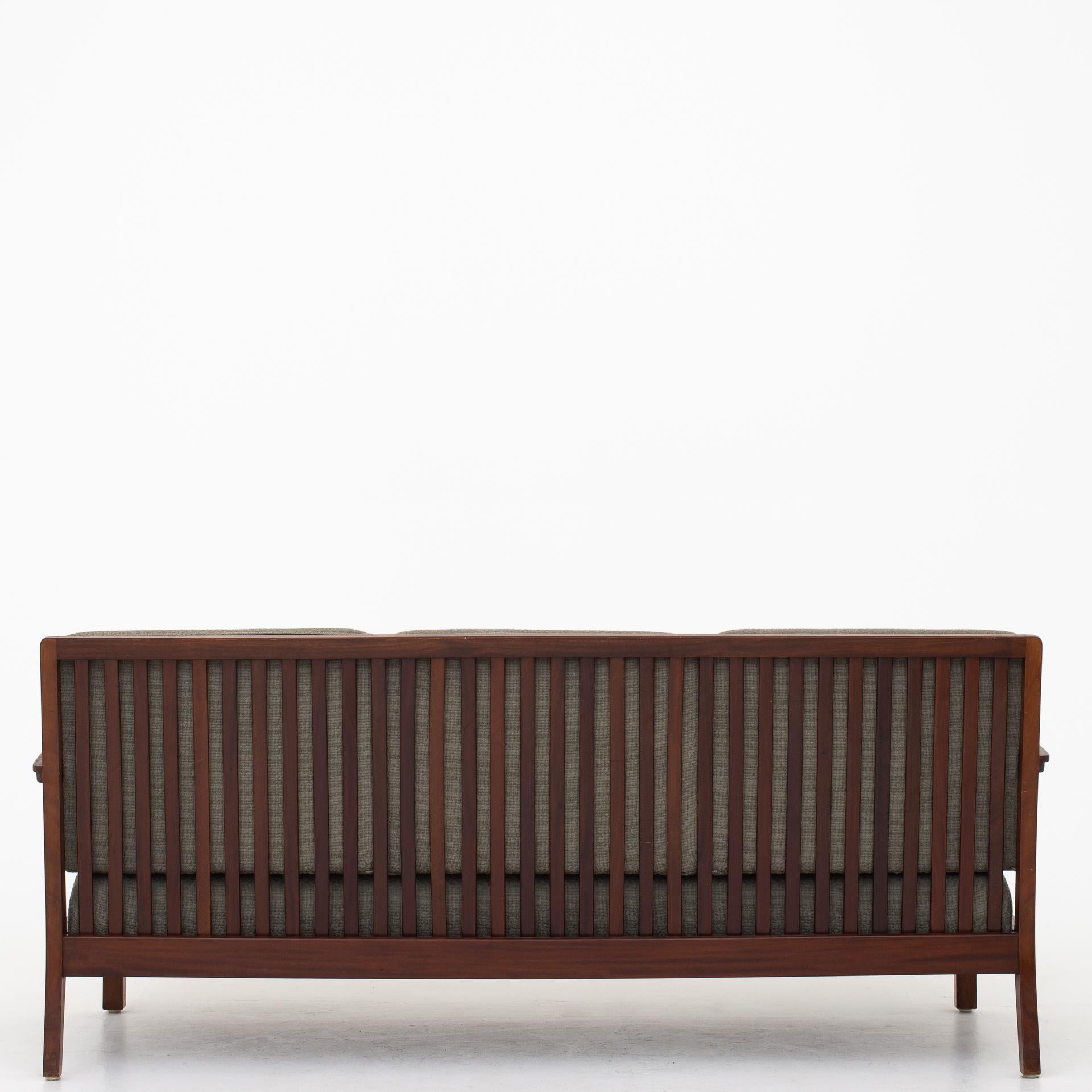 3-seat sofa in original green wool with mahogany frame. Maker Gustav Bertelsen.
