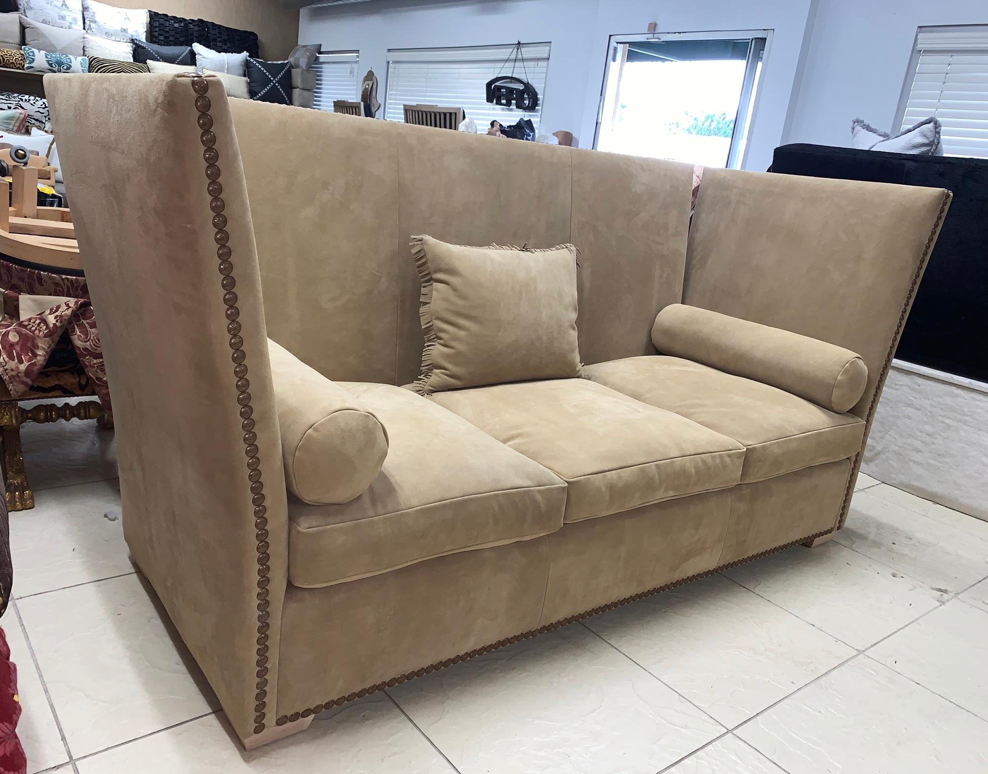 Beautiful 3-seat sofa in the Knole style, upholstered in brown suede with brass nail-head trimming, newly upholstered, the cushions are down-filled all new material, the sofa is in excellent condition and ready to be displayed.
Measurements:
8ft