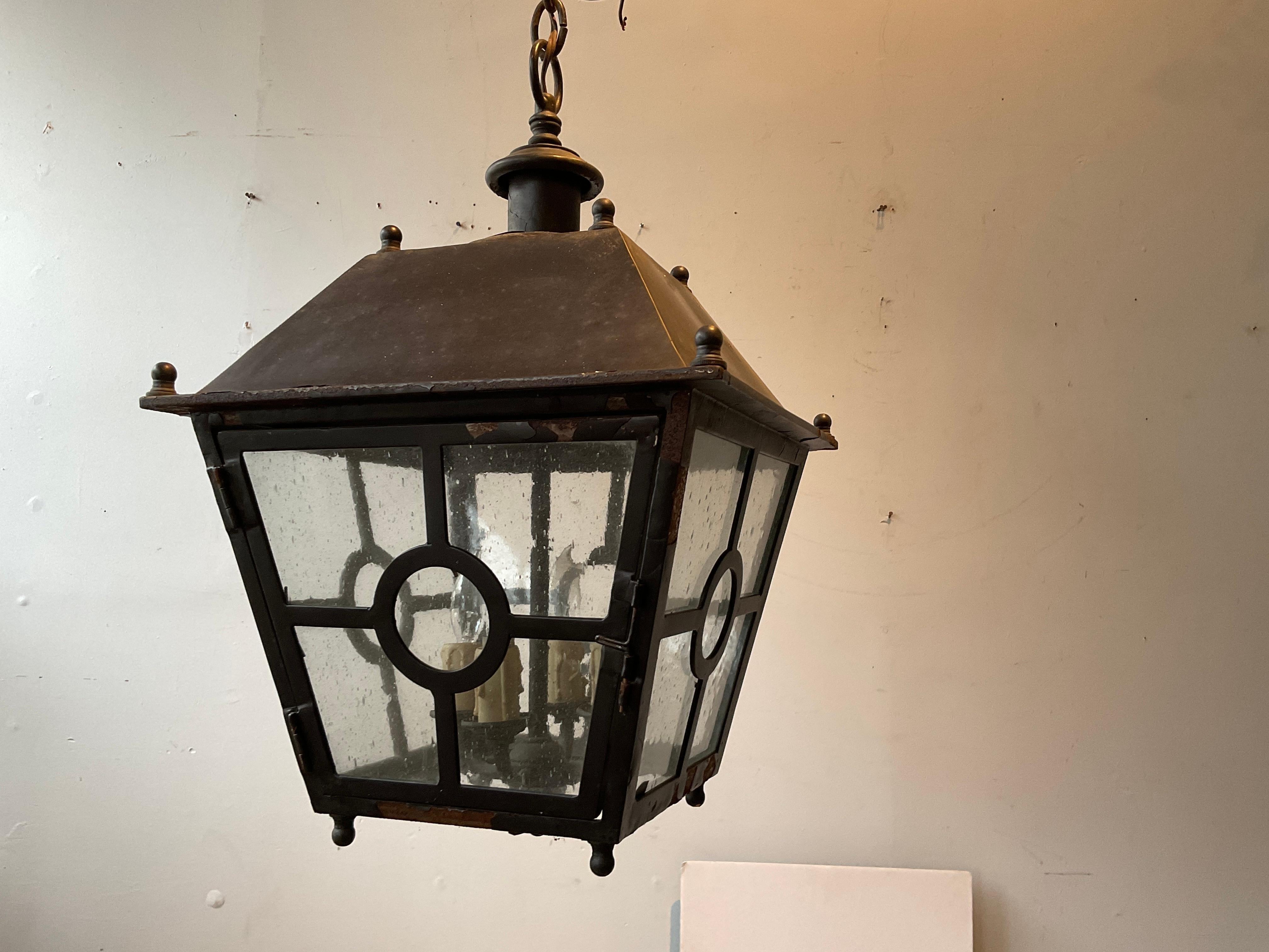 3 Steel classical lanterns with antiqued bubble glass.
Needs rewiring. Finish peeling off in spots.