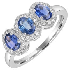 Anello a fascia con 3 pietre di zaffiro blu di Ceylon e diamanti in oro bianco 18 carati