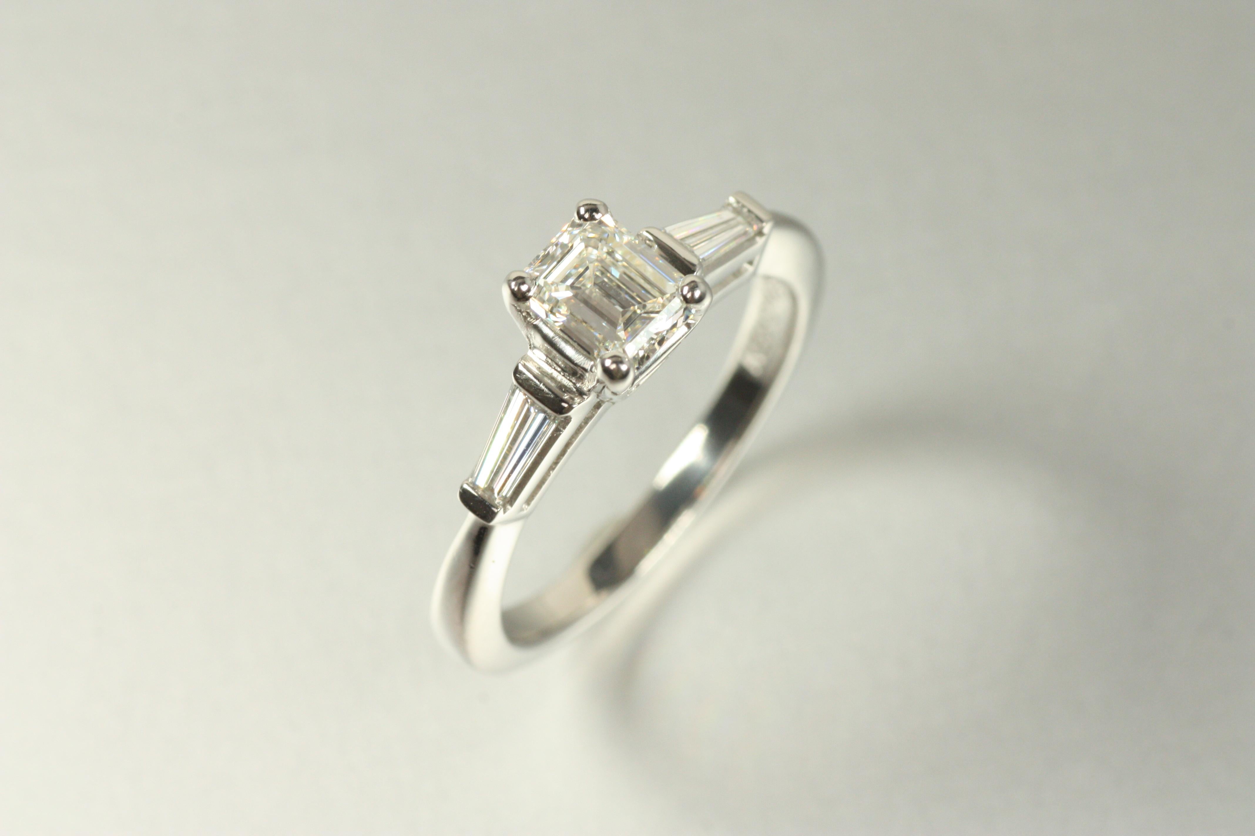 Modern 3-Stone Diamond Engagement Ring – 0.84ct Emerald Cut & Baguettes Platinum For Sale