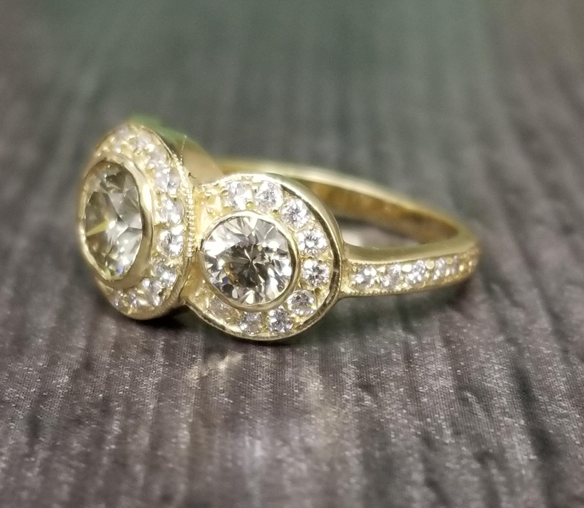 18k yellow gold ladies 3 stone halo ring containing 3 yellow diamonds weighing 1-.75pts., 2-.78pts., also 43 round full cut diamonds of very fine quality weighing .58pts.