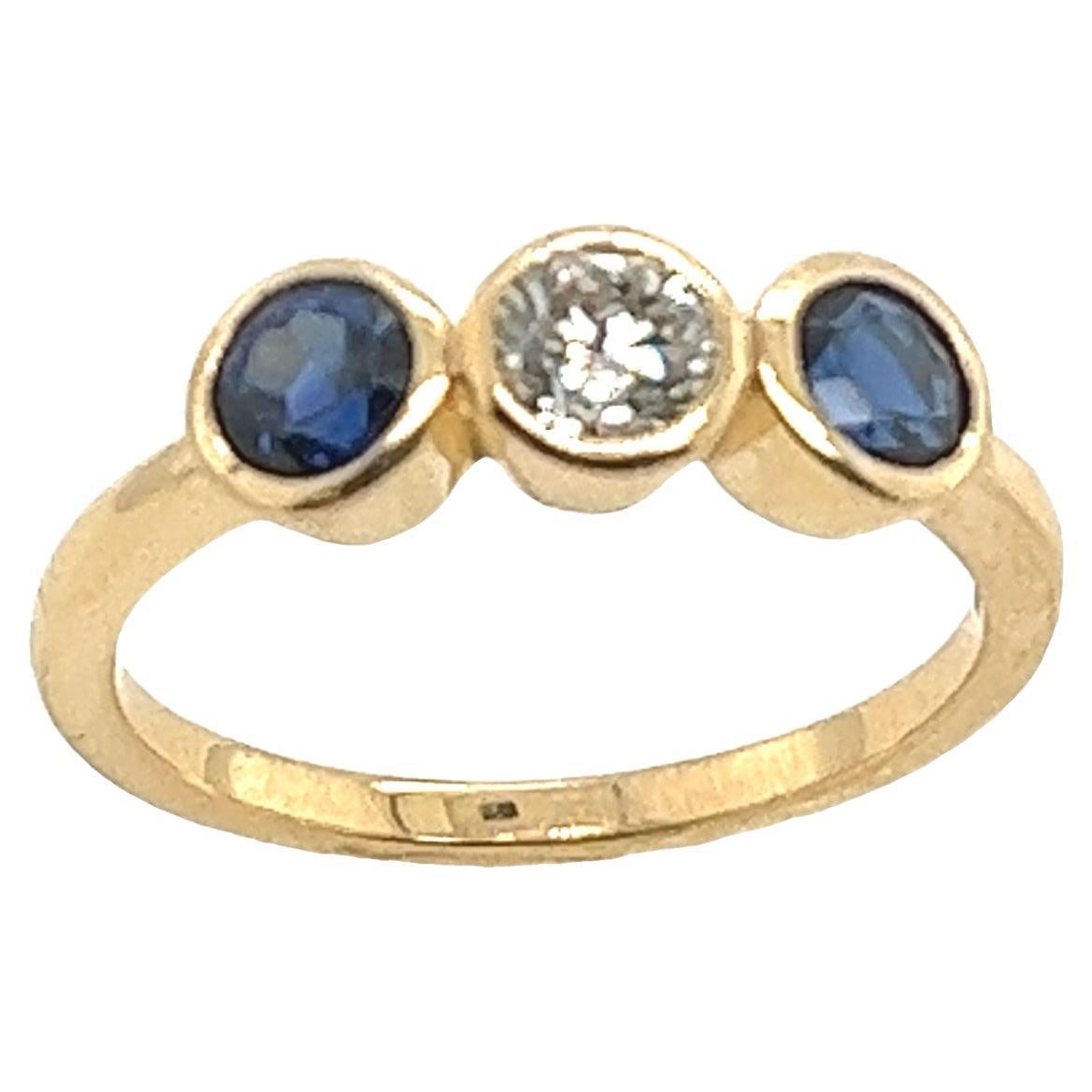 3-Stone Diamond Ring, Set With 1 Round Brilliant Diamonds & 2 Sapphires For Sale