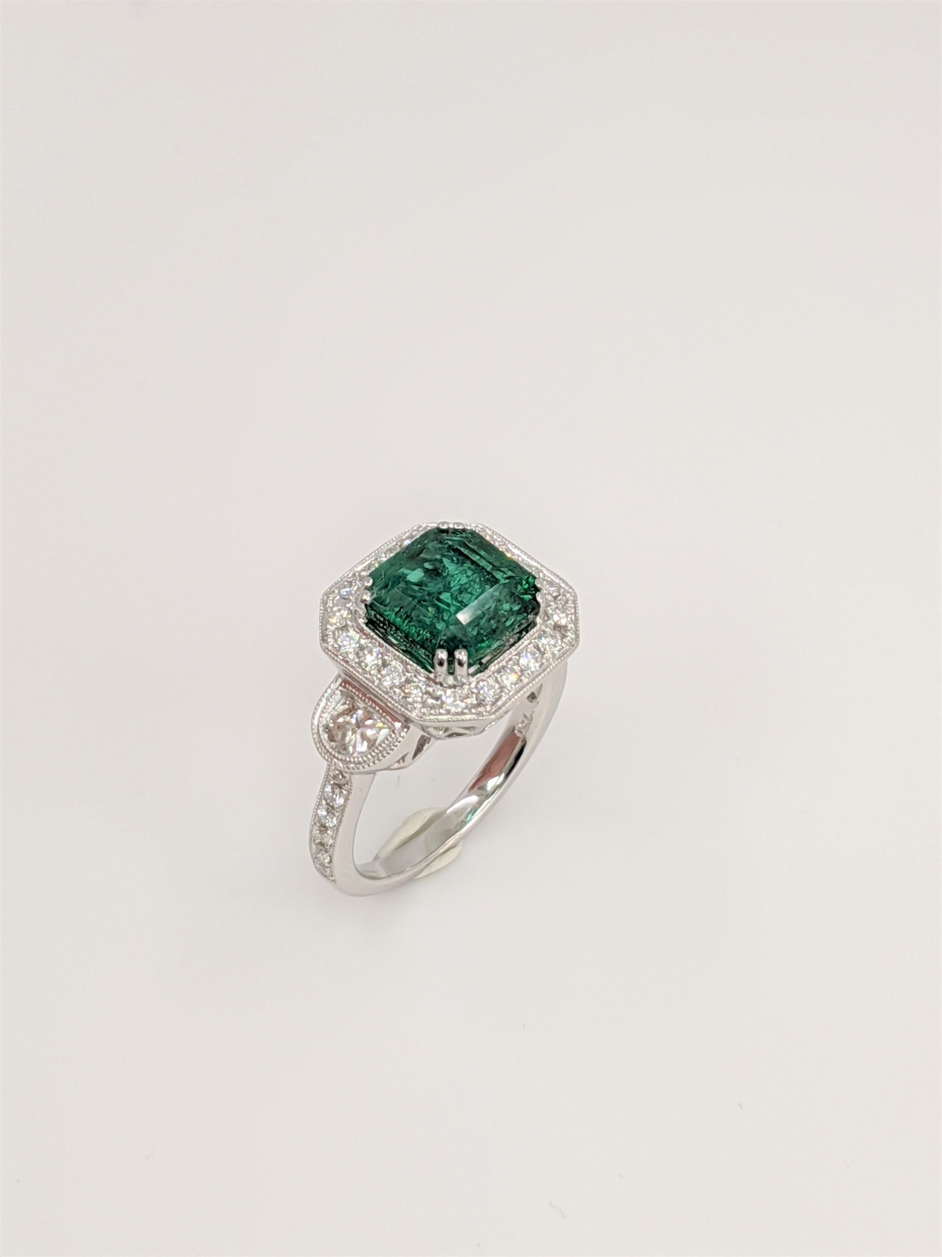 3 Stone Style, Emerald, White Diamond, 18k White Gold, Ring
Emerald  3.36 carats,  8.5 x8.5 mm
Diamonds  .87 carats