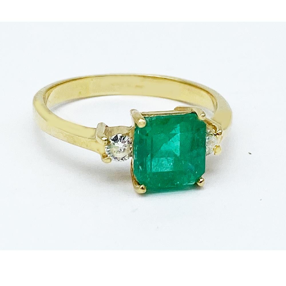 1.50 Carat Princess Emerald and Diamond Ring, 18 Karat Yellow Gold
Gorgeous Emerald of Colombian origin measures 7.16-7.06 X 4.50 in diameter. The estimated weight of the emerald is 1.50 carat.
The cut of emerald is a princess and is flanked by a