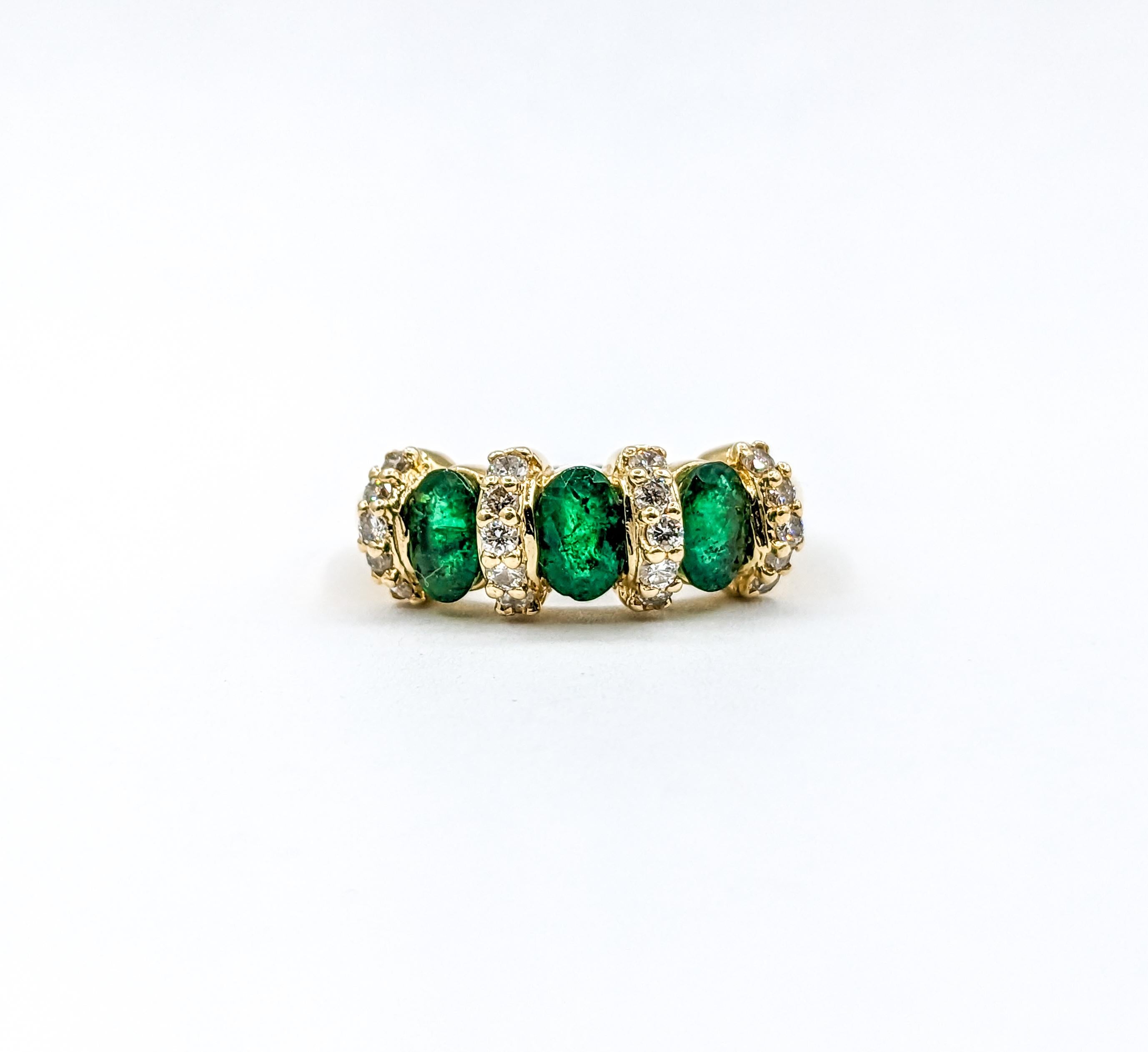 3-Stone Emerald & Diamond Ring in Yellow Gold

This stunning ring is crafted from 14k yellow gold and features a 1.20ctw oval cut emeralds as its centerpiece, surrounded by sparkling round diamonds with a total weight of 0.20ctw. The diamonds are of