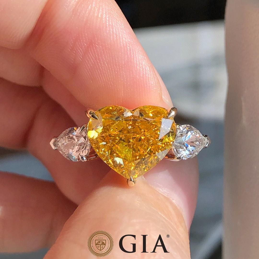 Heart Cut 3 stone engagement ring in 5 carat heart cut Deep Yellow diamond GIA certified For Sale