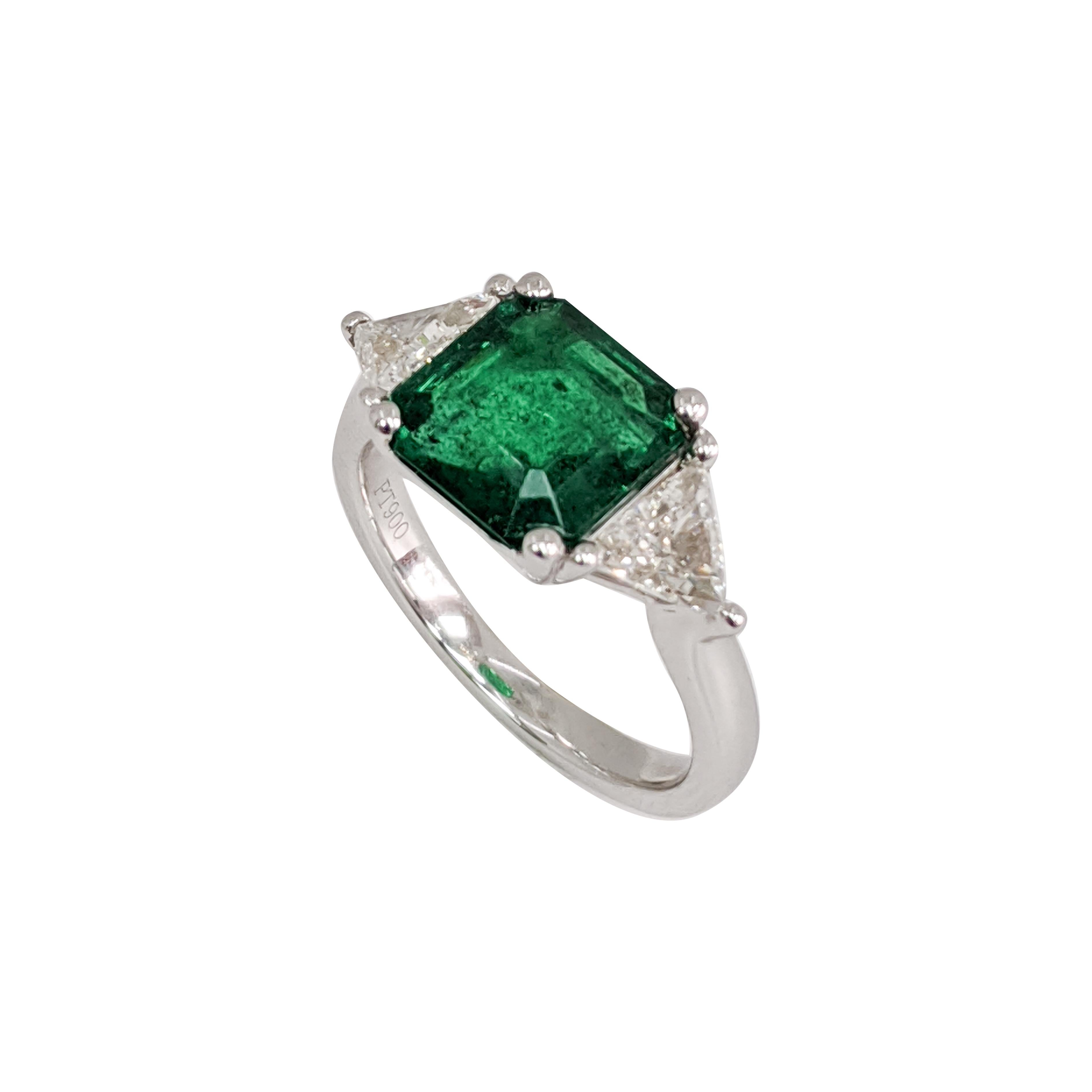 3 Stone Ring with an Emerald (Emerald Cut), Trillion Cut Diamond, and a Platinum Ring.

.80ct Trillion Diamond
2.95ct Emerald 9X9 MM
#17582