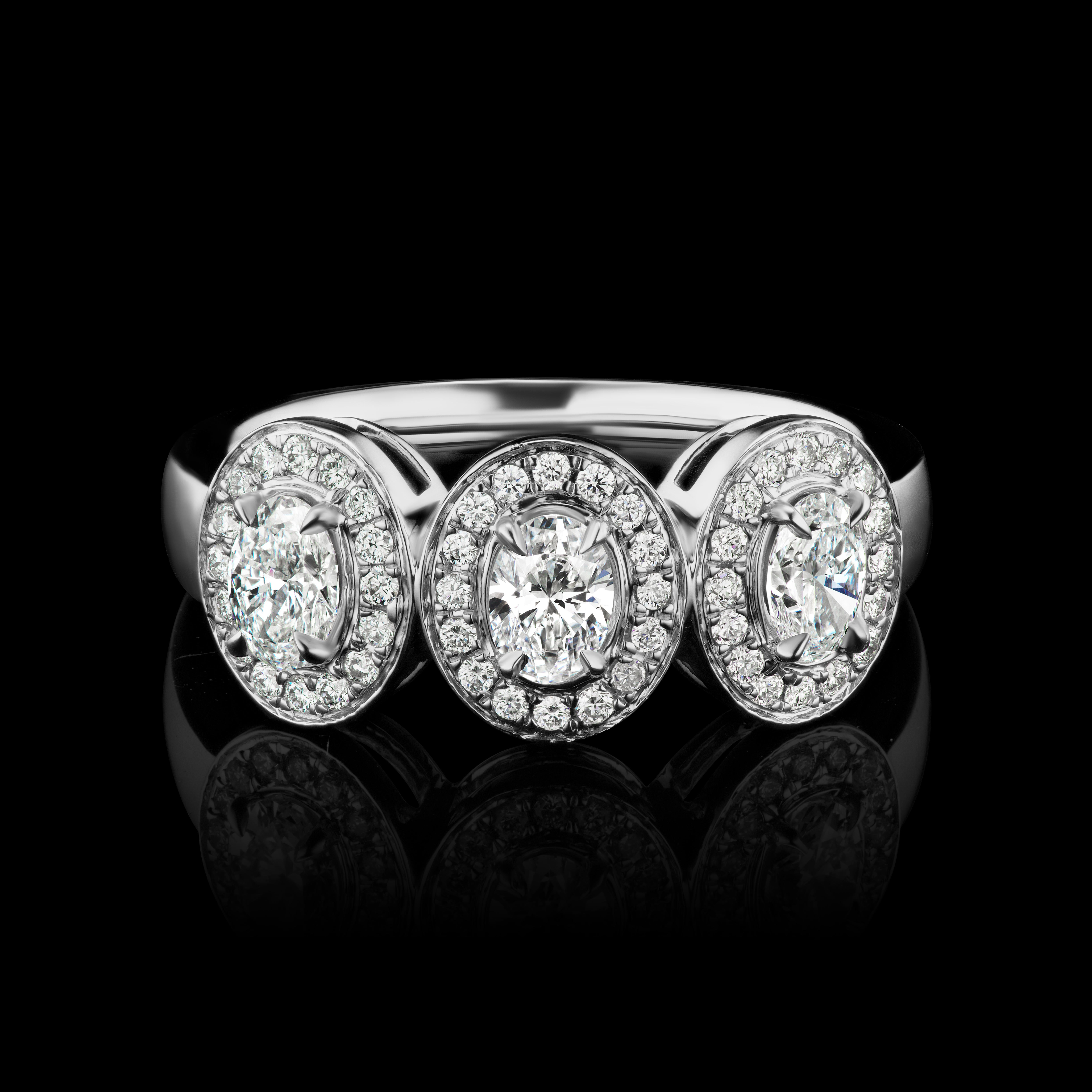 Past Present Future Three Oval Diamond Ring in 18K White Gold ( 1.55 ct. tw. )

Classic and elegant, this ring made with Three matching oval diamonds symbolizes love in a perfectly delicate all around pave diamond halo. The shank is also embellished