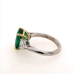3-Stone Oval Emerald and Heart Shape Diamond Ring