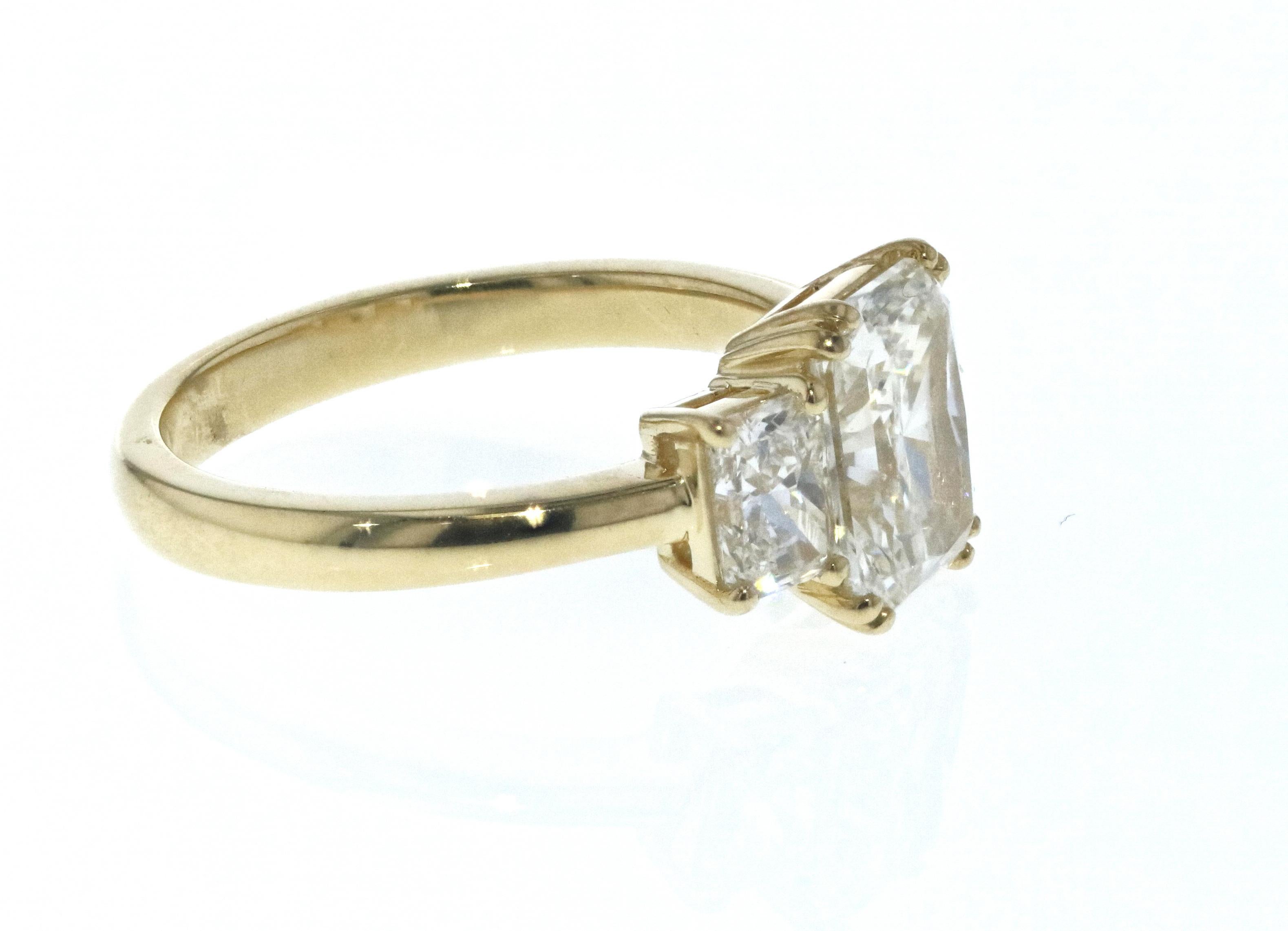 radiant cut three stone engagement ring