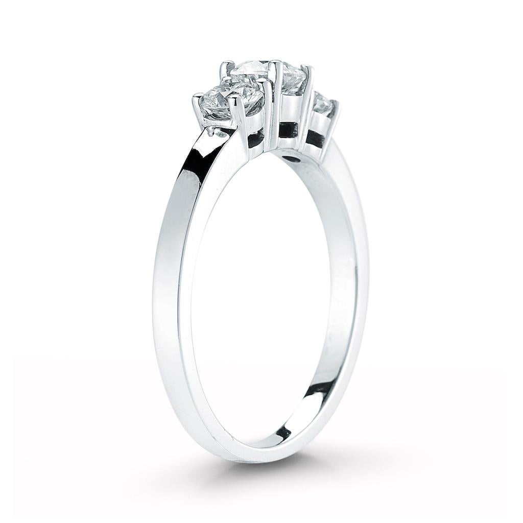 This 3 stone diamond ring features a round center stone. The diamonds are available in all sizes, colors and qualities. Setting available in platinum, gold, white gold, and rose gold. White gold is rhodium plated for lasting durability. Made to