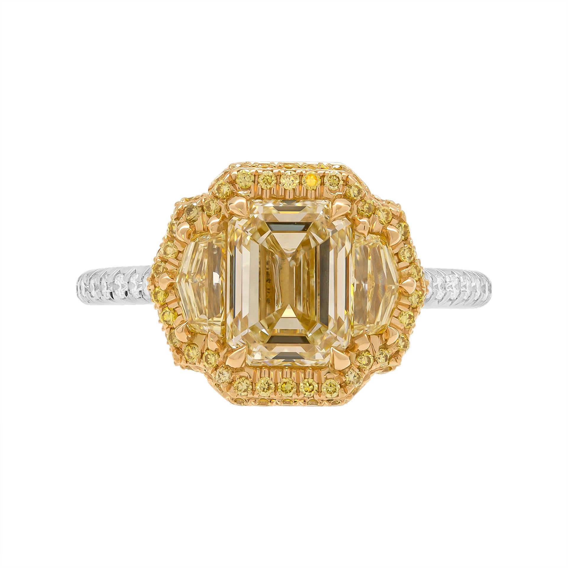 3 stone ring in Platinum & 18K Yellow Gold
Center: 2.01ct W-X Range VS1 Emerald shape diamond GIA#6415878666 
Has a look of a Fancy Yellow Diamond!\

Side stone: 
0.20ct Fancy Light Yellow VVS1 trapezoid shape diamond GIA#2221772968
0.21ct Y-Z VVS1