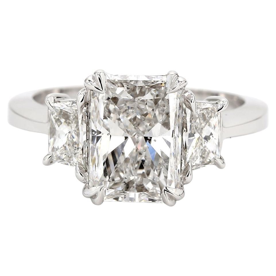 3-Stone Ring w/ GIA Certified E/SI1 3.01ct. Radiant Cut Diamond.  D3.84ct.t.w.