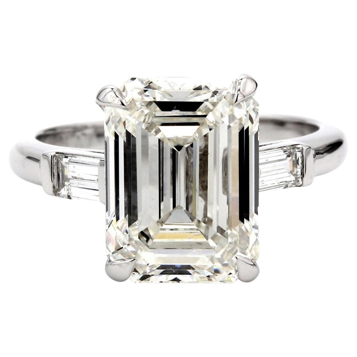 3-Stone Ring with F/SI1 GIA Emerald Diamond Center. and Baguette Sides. D3.90ct.