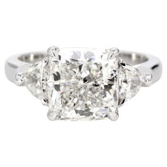 3-stone Ring with GIA G/VS2 Cushion Center and Half Moon Sides. D4.32ct.t.w.