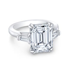 3-stone Ring with GIA H/VS2 Emerald Center and Baguette Sides. D6.50ct.t.w.