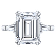 3-stone Ring with GIA H/VS2 Emerald Center and Baguette Sides. D6.50ct.t.w.