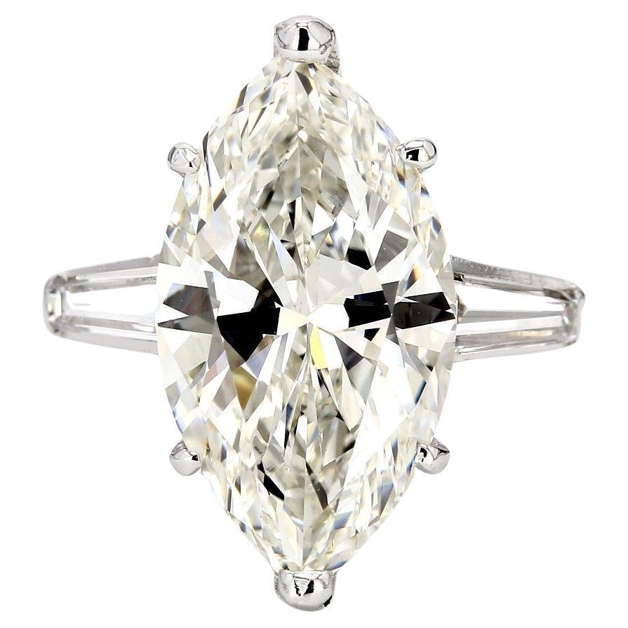 3-stone Ring with GIA I/SI2 Marquise Diamond Center and Baguette Sides. D5.49ct. For Sale