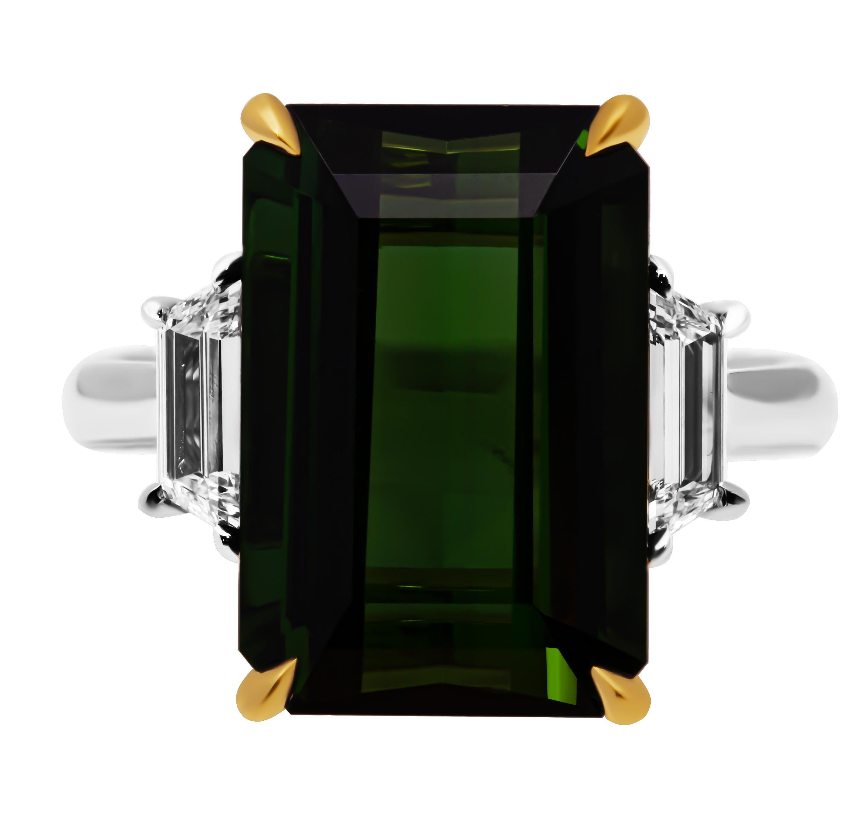 Three stone ring in 18K Yellow Gold and Platinum with Green Tourmaline

Center stone is:  8.67ct Green Tourmaline
Side stones are GIA Certified:
​​0.30ct D VVS2 GIA#2486114124 trapezoid cut diamond
0.30ct D VVS1 GIA#7483113973 trapezoid cut
