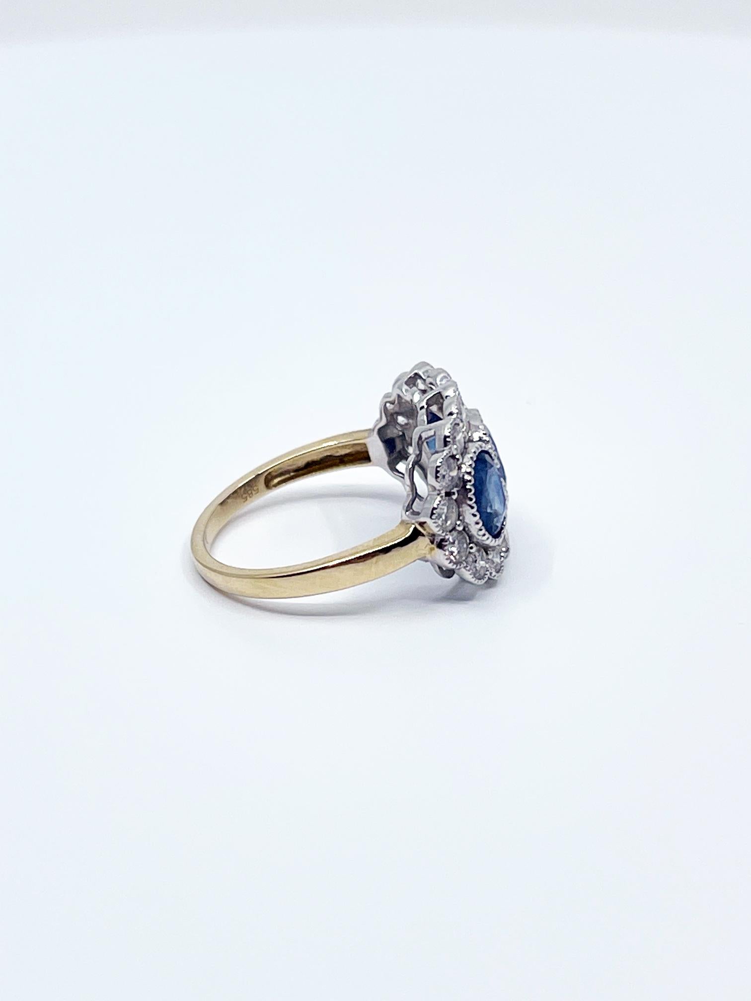 Total weight 3.13ct sapphires surrounded by 18 diamonds (1ctw). Set in 14ct yellow and white gold two tone effect with detailed milgrain edging. 

The blue of the sapphires in the light is incredible.

Ring size M.

