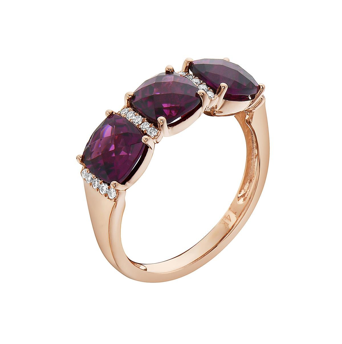 With this exquisite semi-precious rhodolite ring, style and glamour are in the spotlight. This 14-karat cushion cut ring is made from 3.4 grams of gold, 3 rhodolites totaling 3.94 karats, and is surrounded by 20 round SI1-SI2, GH color diamonds