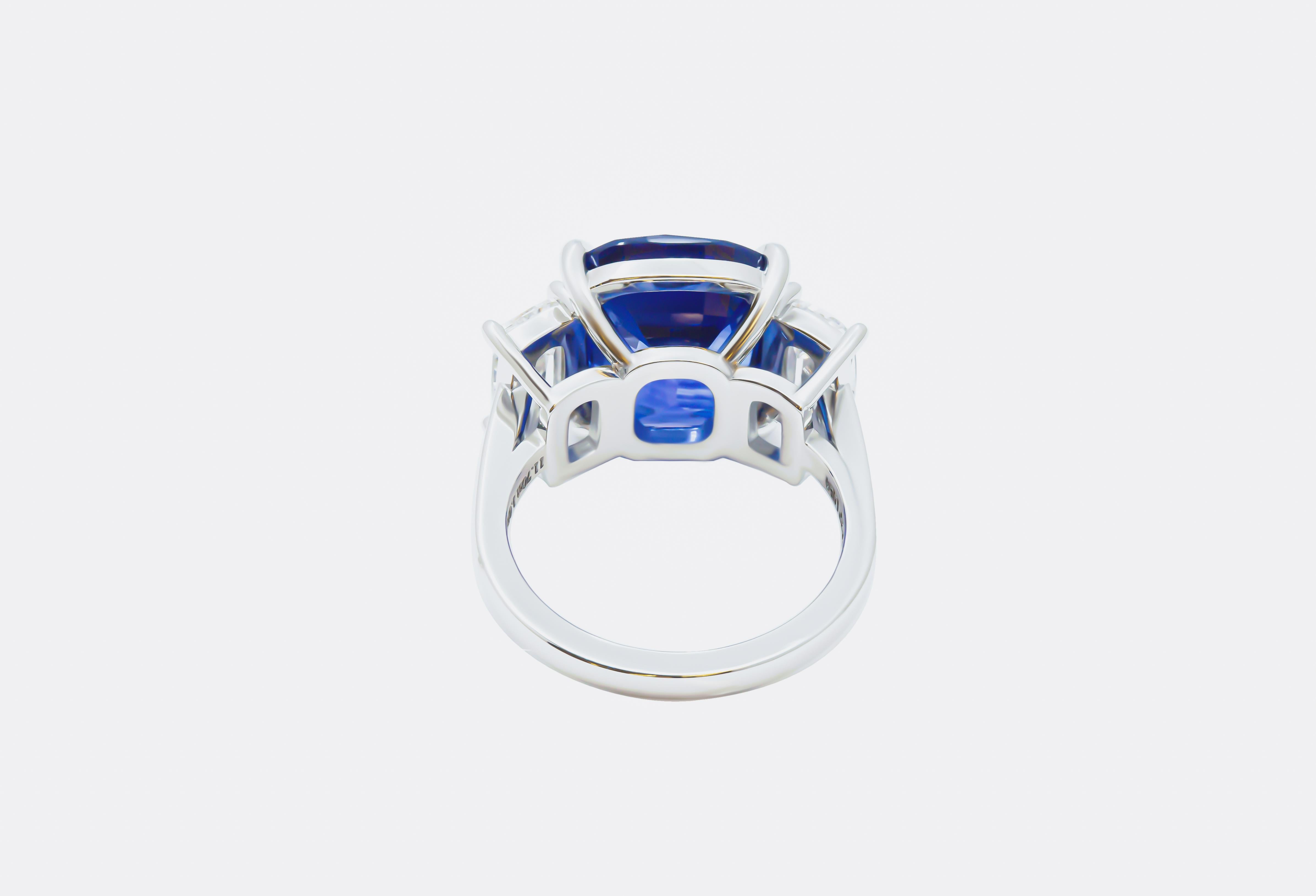 Introducing a truly enchanting masterpiece, behold the exquisite allure of our three-stone ring featuring a magnificent 11-carat blue cushion-cut sapphire as its centerpiece. This resplendent gem, certified by the Gemological Institute of America