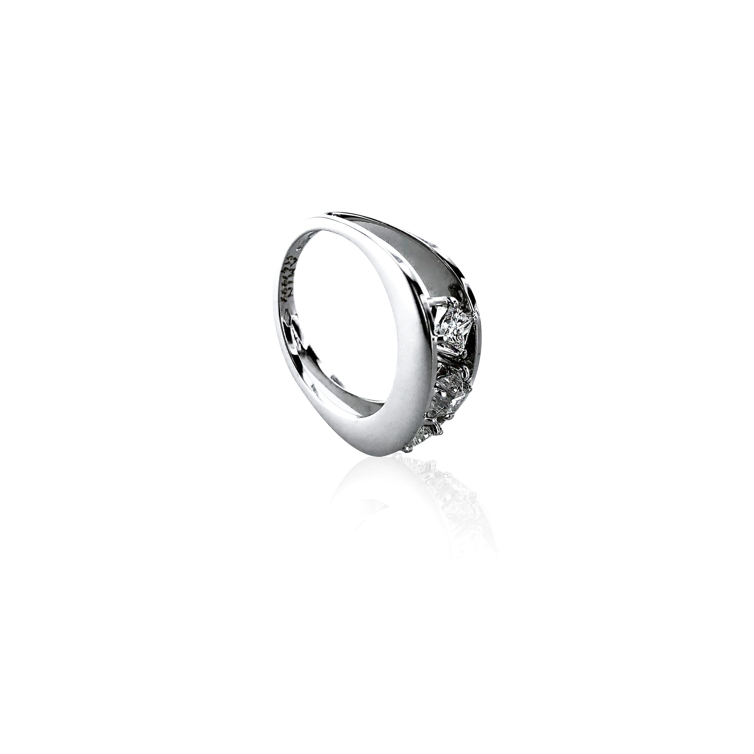 This 0.73 Carat Diamond 18Kt White Gold Trilogy Cocktail Ring is truly unique. 
Artistically designed with 3 diamond stars of equal size, set within 2 bands of white Gold, making a very stylish unisex ring.  

Produced, designed and certified in