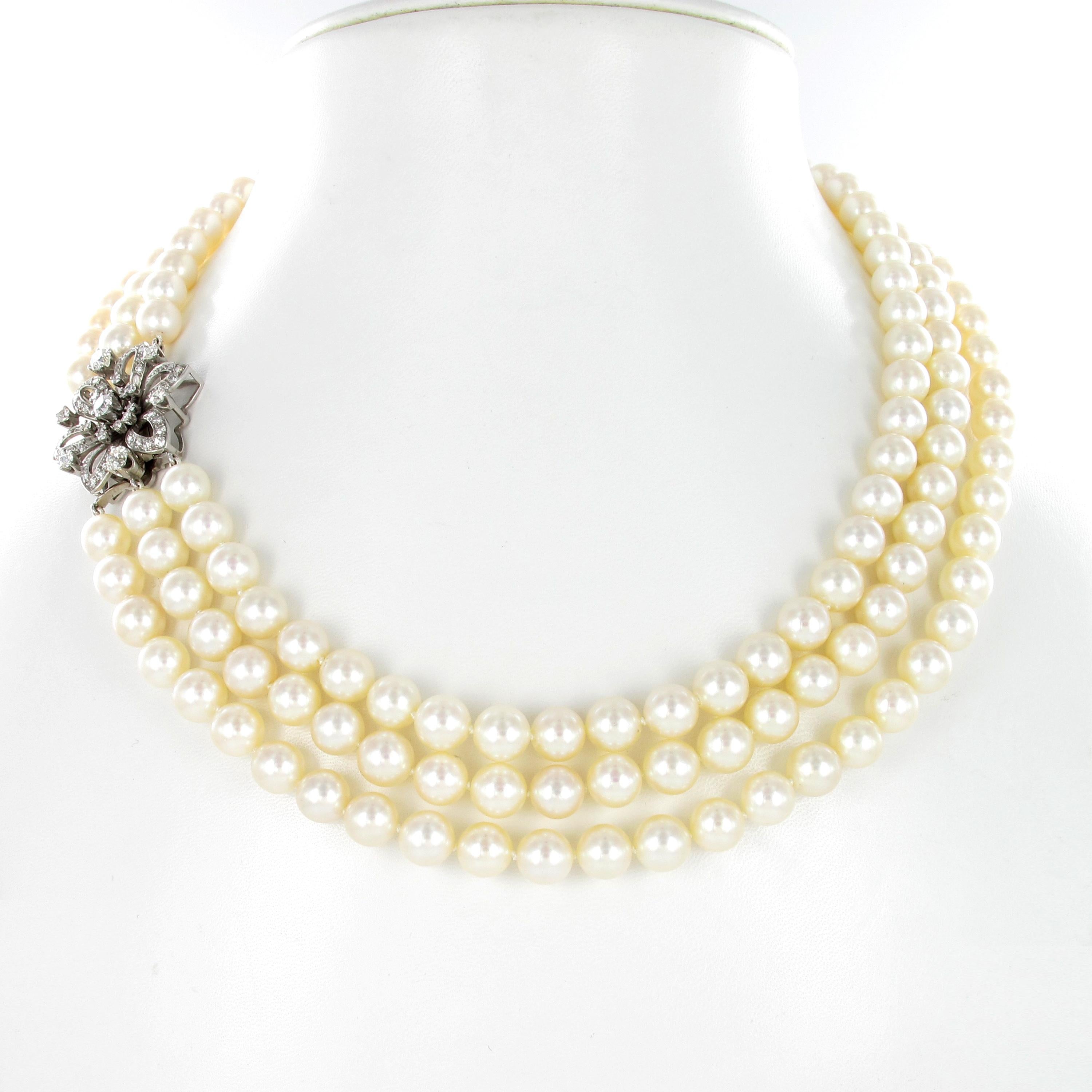 This Breakfast at Tiffany's like 3-strand cultured pearl necklace goes with every little black dress. The 166 Akoya cultured pearls measure 8.0-8.5 millimeters and are adjusted to a beautiful flower clasp in 18 karat white gold, set with 61 Old
