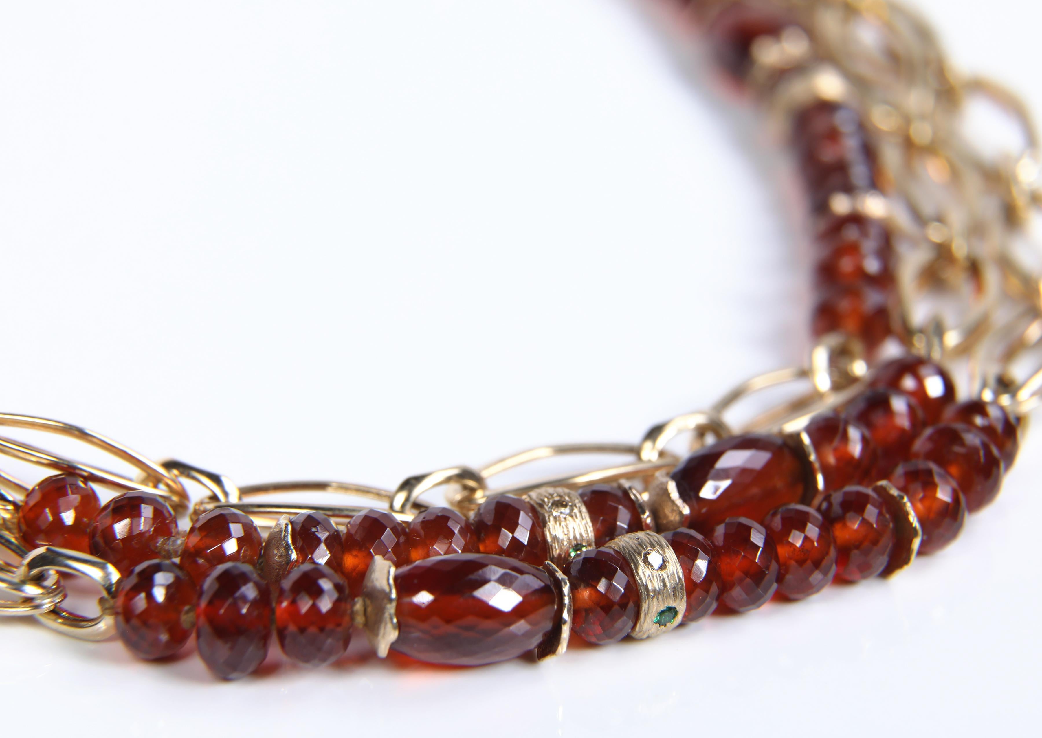 Creating a necklace with spessartite and tsavorite garnet, Champagne diamonds, and gold captures the essence of 