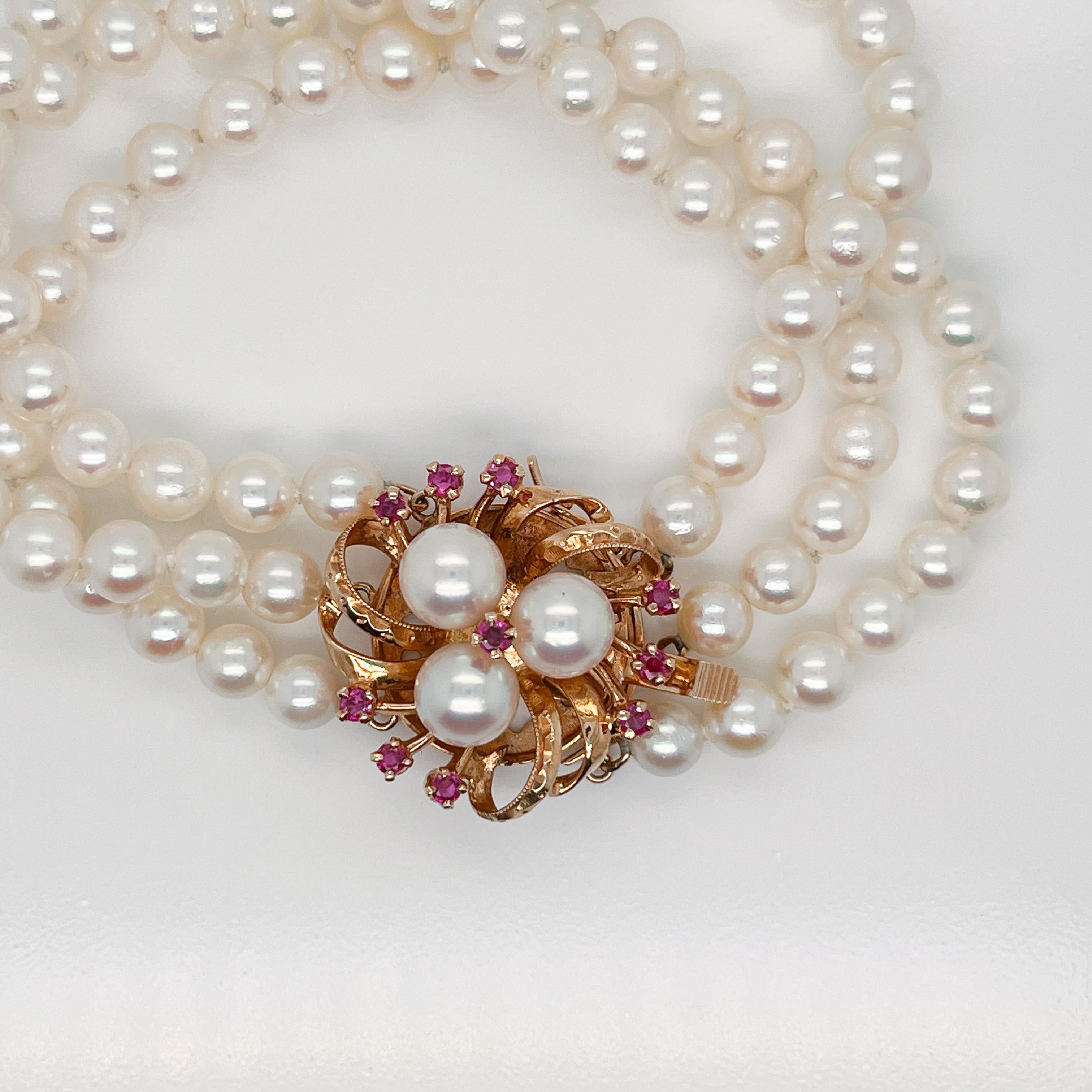 Round Cut 3-Strand Tasaki Akoya Pearl Bracelet with 14 Karat Gold & Ruby Clasp