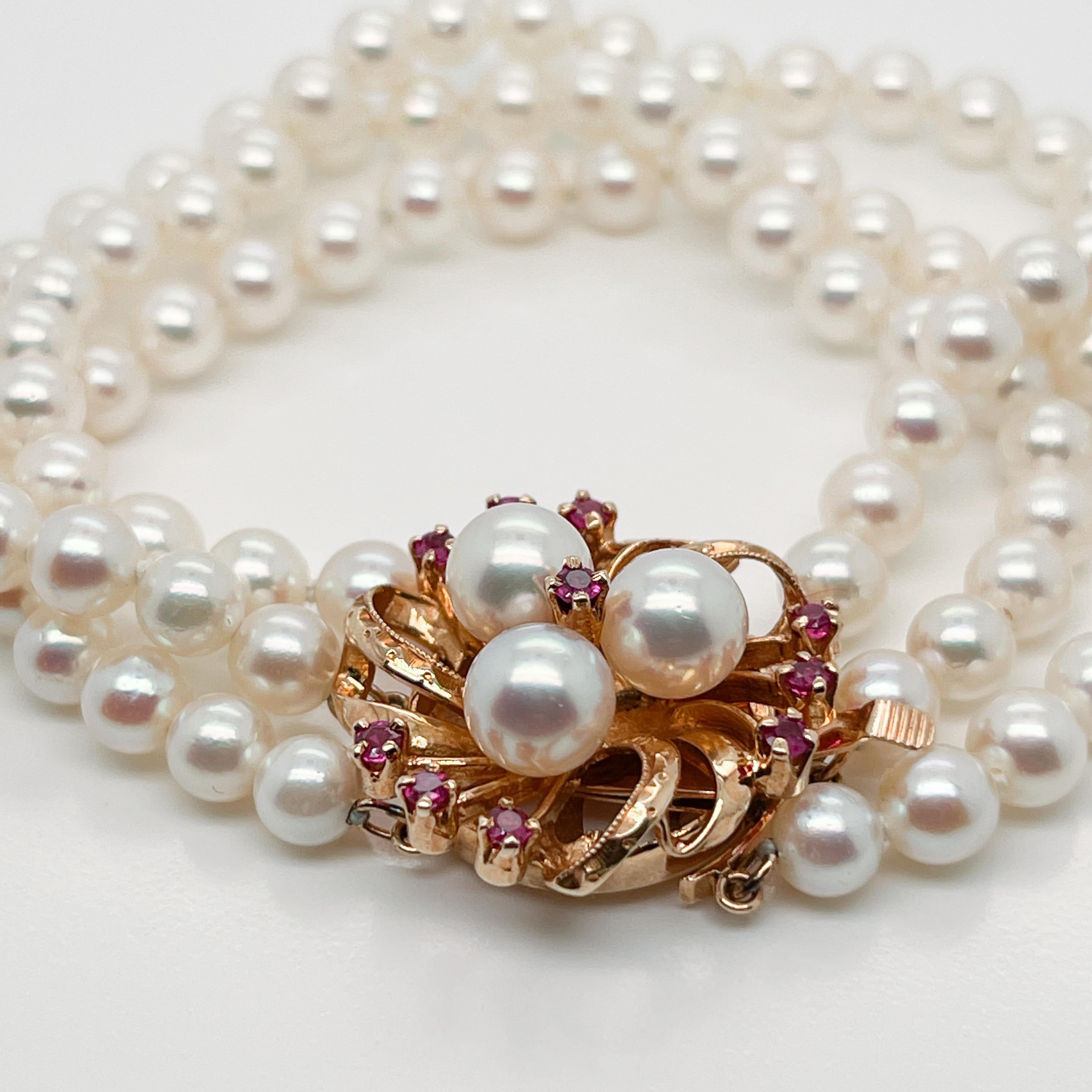 3-Strand Tasaki Akoya Pearl Bracelet with 14 Karat Gold & Ruby Clasp In Good Condition In Philadelphia, PA