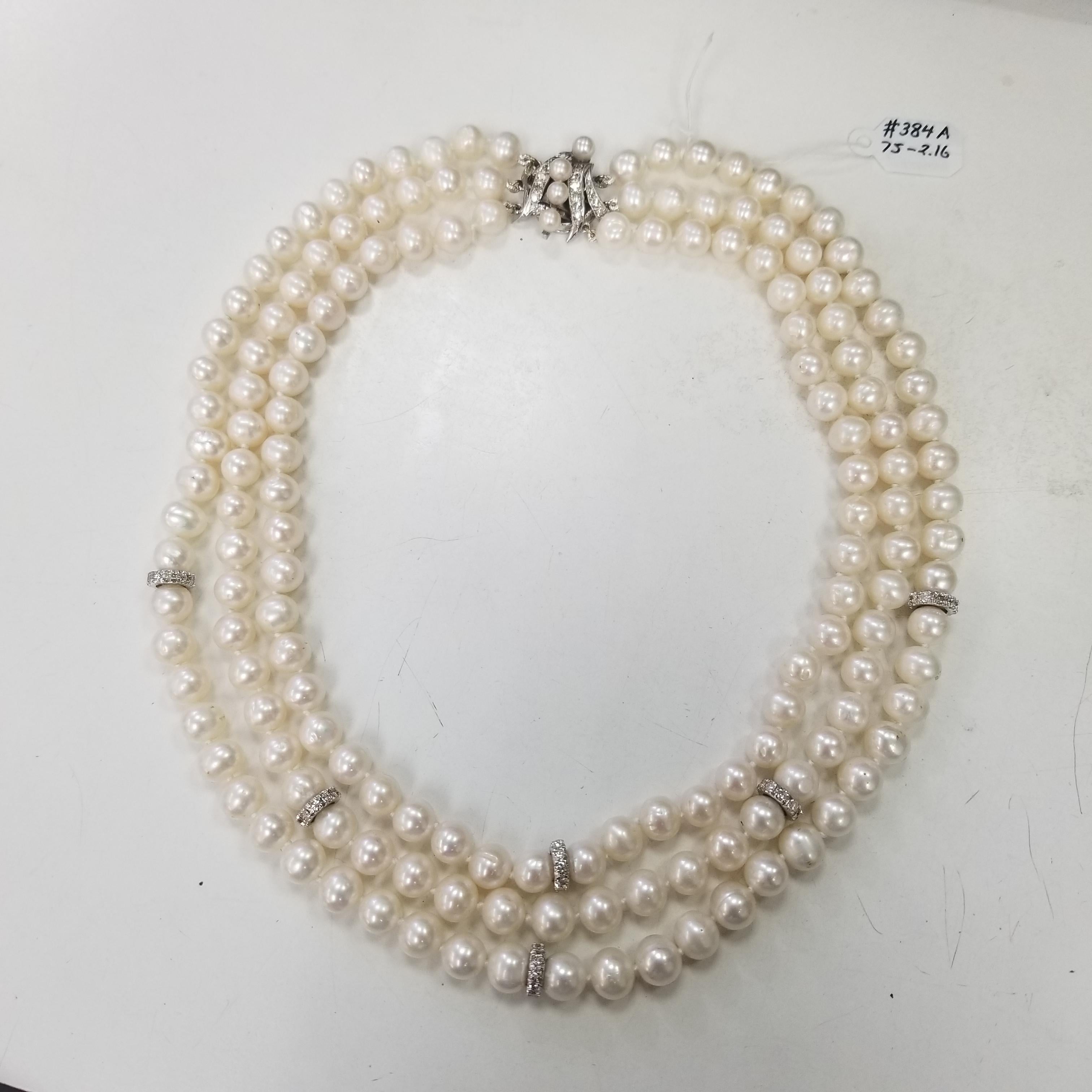 Three (3) strands of fresh water cultured pearls 7.5-7.75mm enhanced with 14k white gold and diamond rondles. The three strands together create a lovely layered collar look. This necklace is a pleasing 15 inch, 17 inch and 19 inch length with 20mm