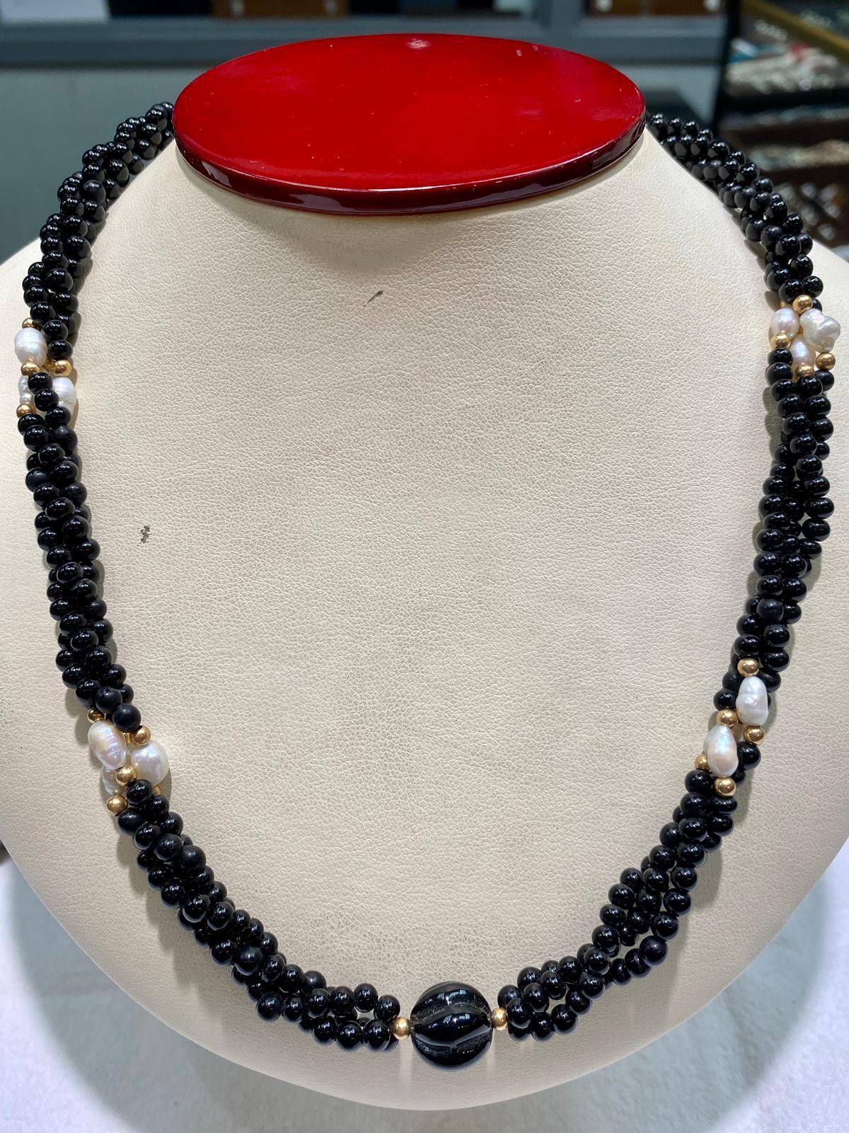 3 strands of onyx pearls with 8pcs of freshwater pearls and 11X12mm onyx centerpiece with 14k yellow gold fish hook
